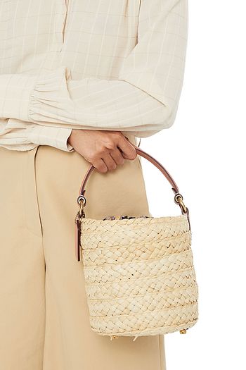 COACH Leather-trimmed braided straw bucket bag