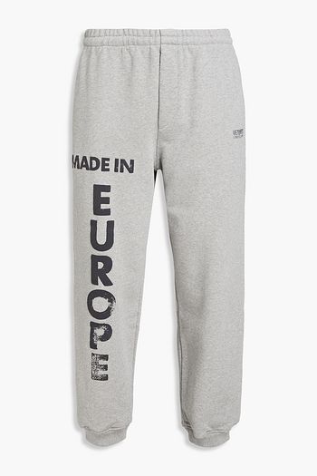 VETEMENTS Tapered printed French cotton-blend terry sweatpants