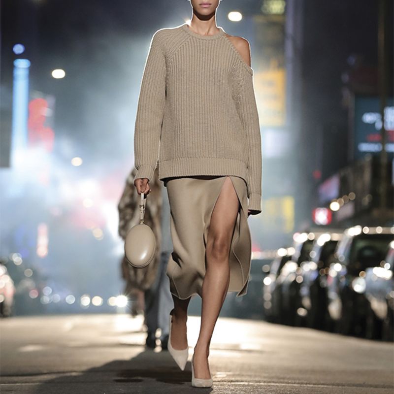 Model wearing blue shirt and sequin trousers by Michael Kors Collection