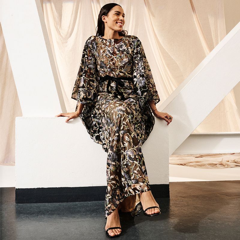 Model wearing camel dress by Rochas, cream bag by Stella McCartney and white boots by Gianvito Rossi.
