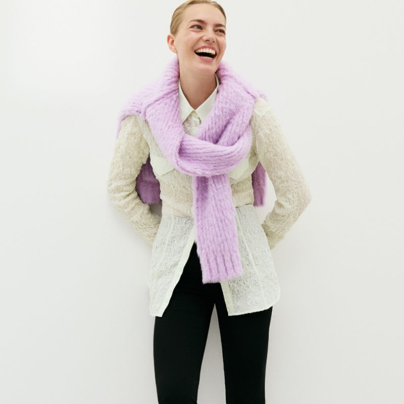 Model wearing grey and navy lace sweater by Acne Studios