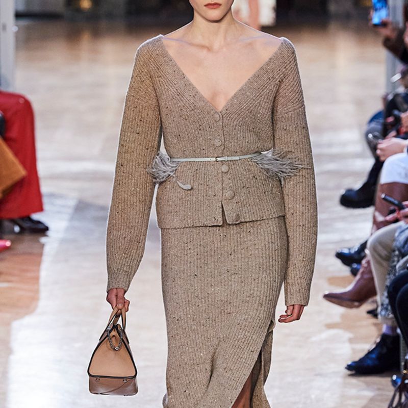 Model wearing grey and navy lace sweater by Acne Studios