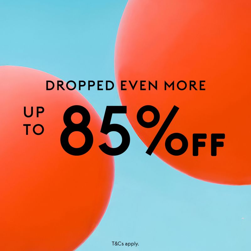 Model wearing leather coat, black pants and mustard knit by Vince