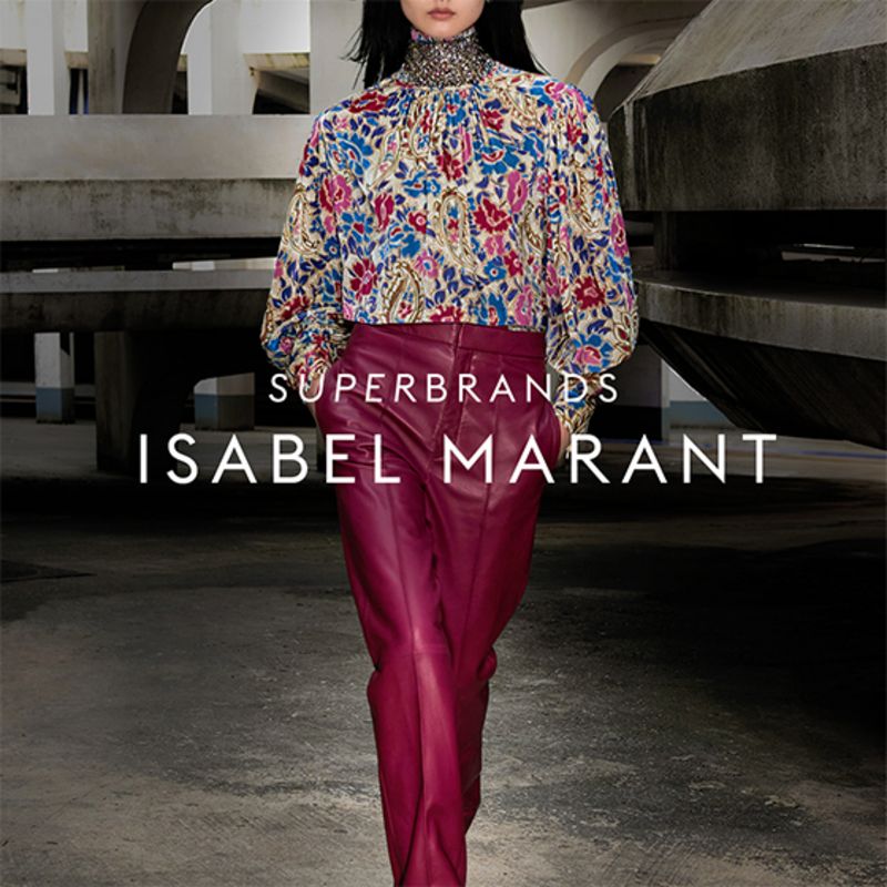 Model wearing red suit by Iris & Ink