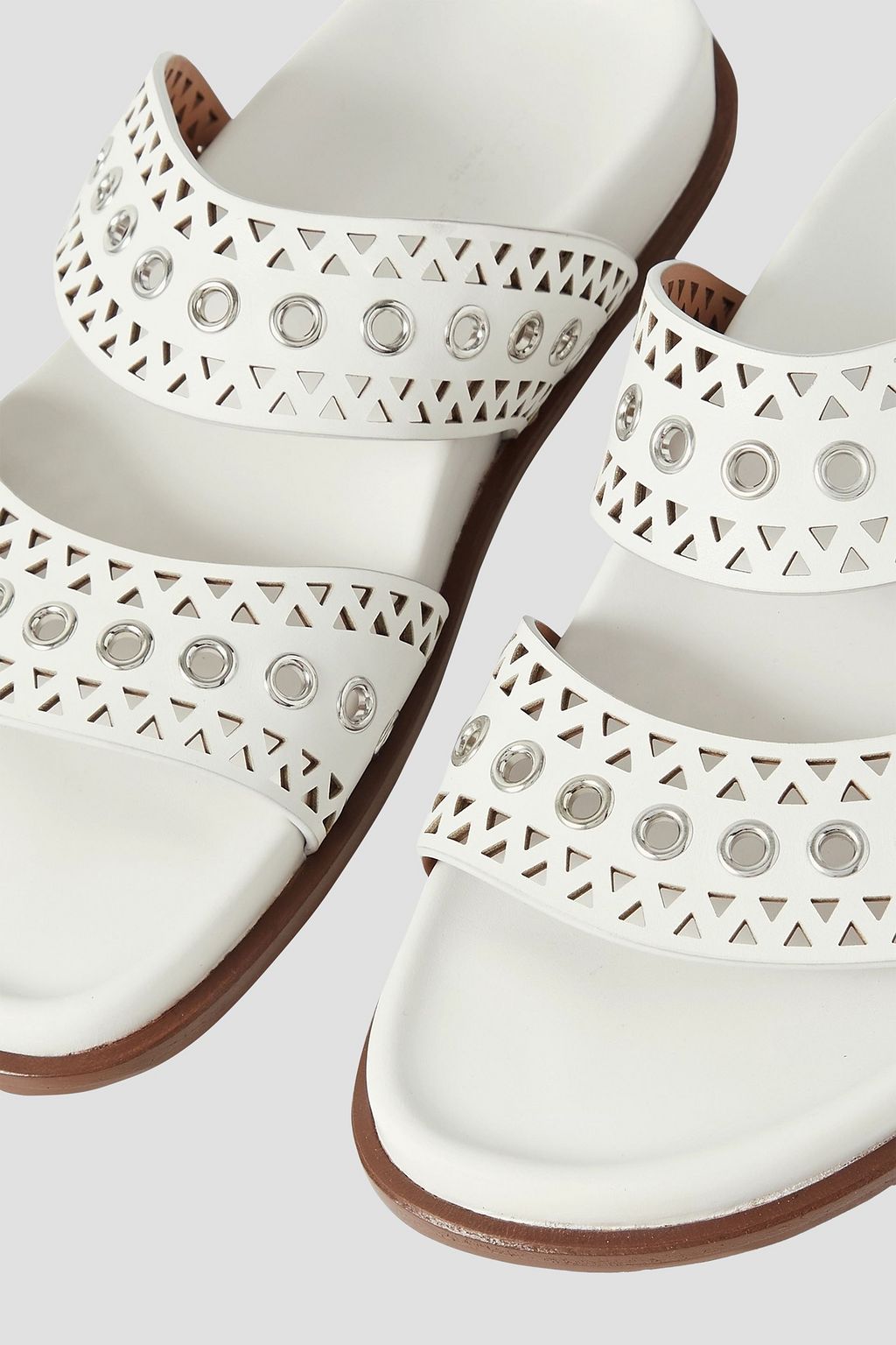 ALAÏA 아일렛 장식 레이저 컷 가죽 샌들