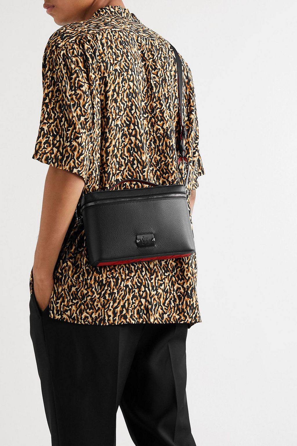 CHRISTIAN LOUBOUTIN Pebbled-leather messenger bag