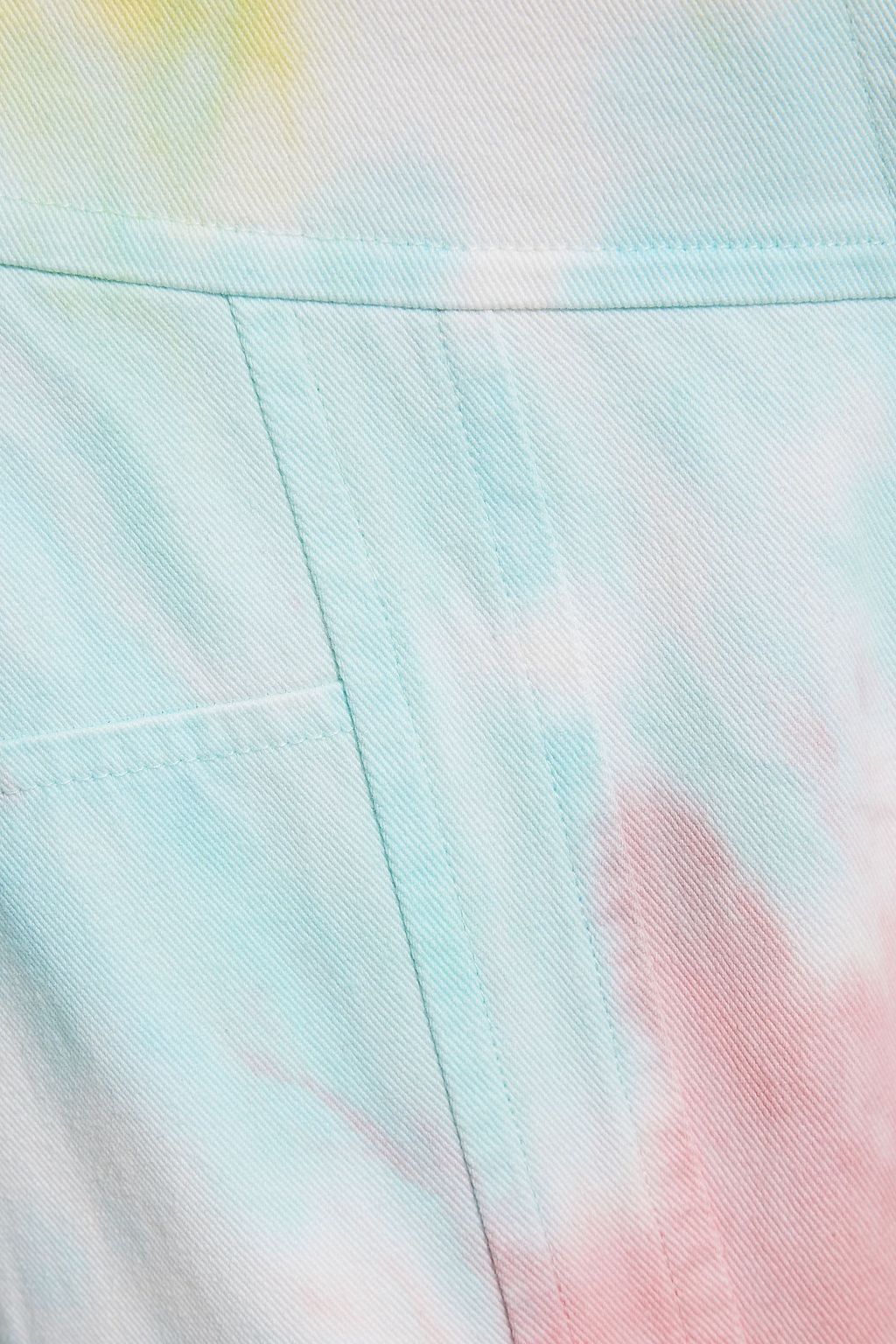 LOVESHACKFANCY بنطلون جينز «تاو» بقصّة مدببة وخصر مرتفع بطبعة متموجة ورباط