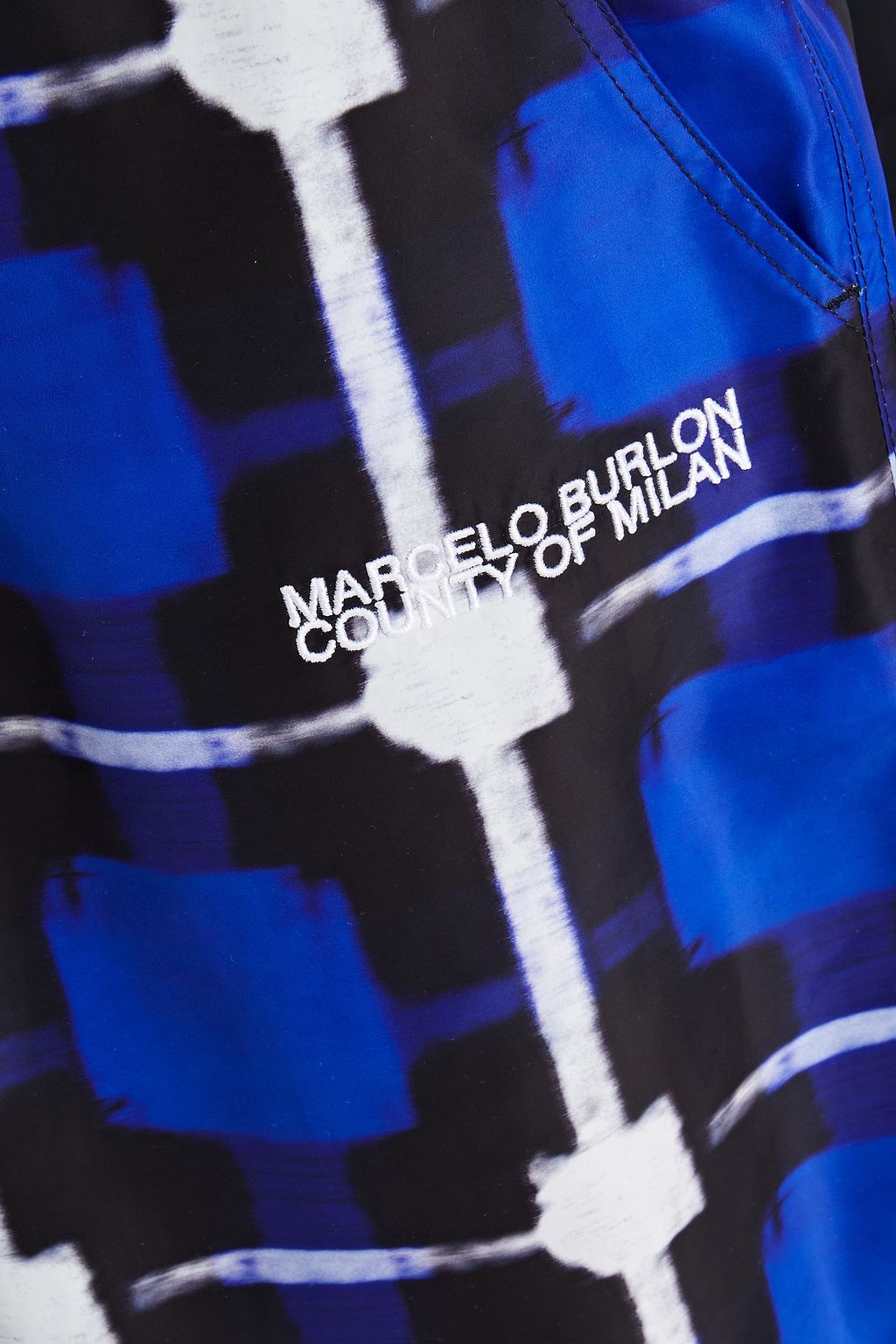 MARCELO BURLON Logo-embroidered checked shell track pants