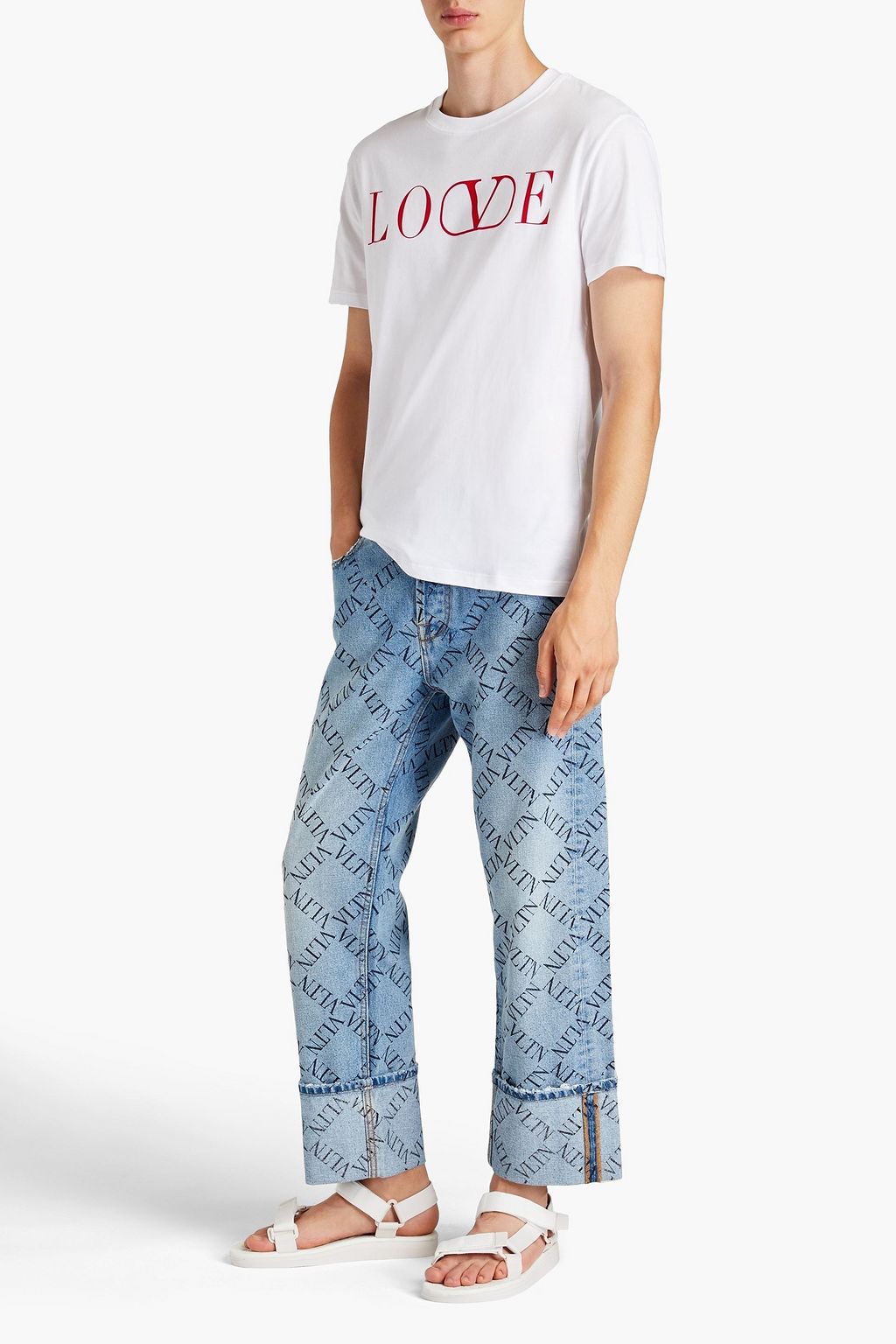 VALENTINO Logo-print distressed denim jeans