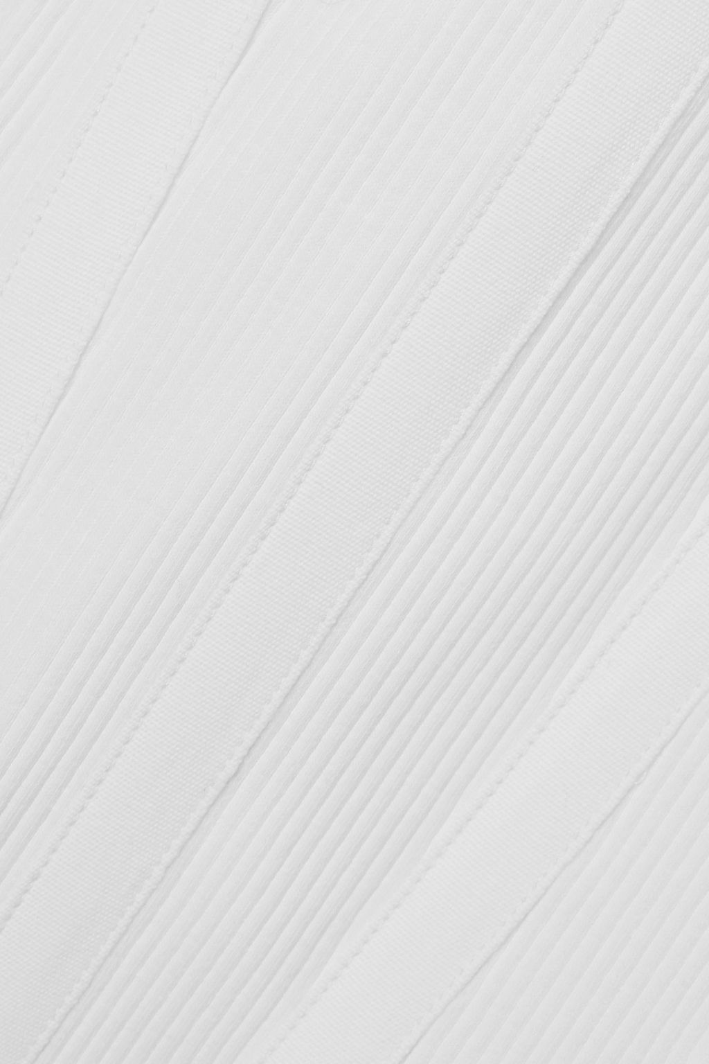 DION LEE بلوزة بوستيه Modular بفتحات من قطن الجيرسي المطاط والمضلّع