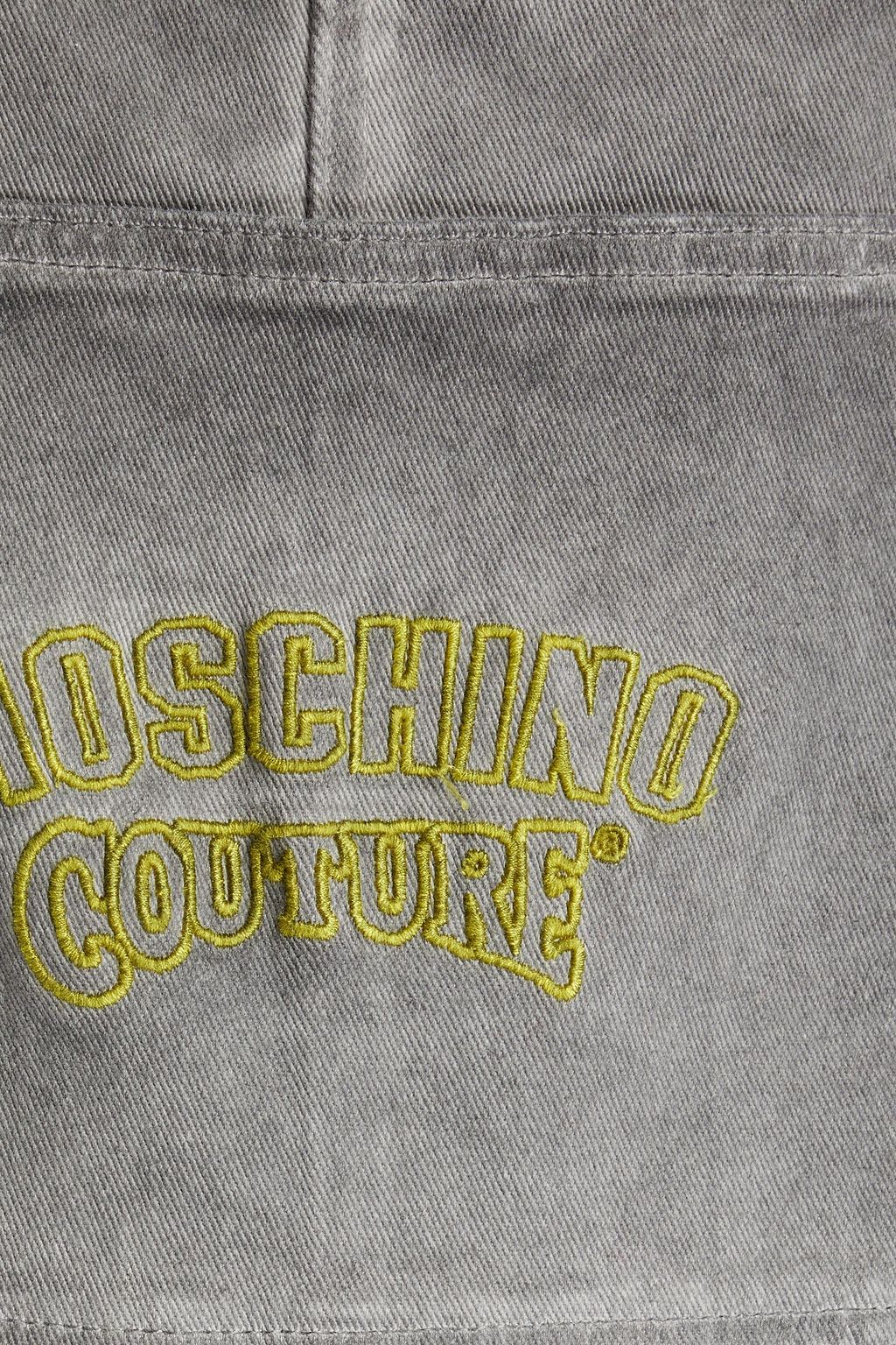MOSCHINO Logo-embroidered faded denim overalls