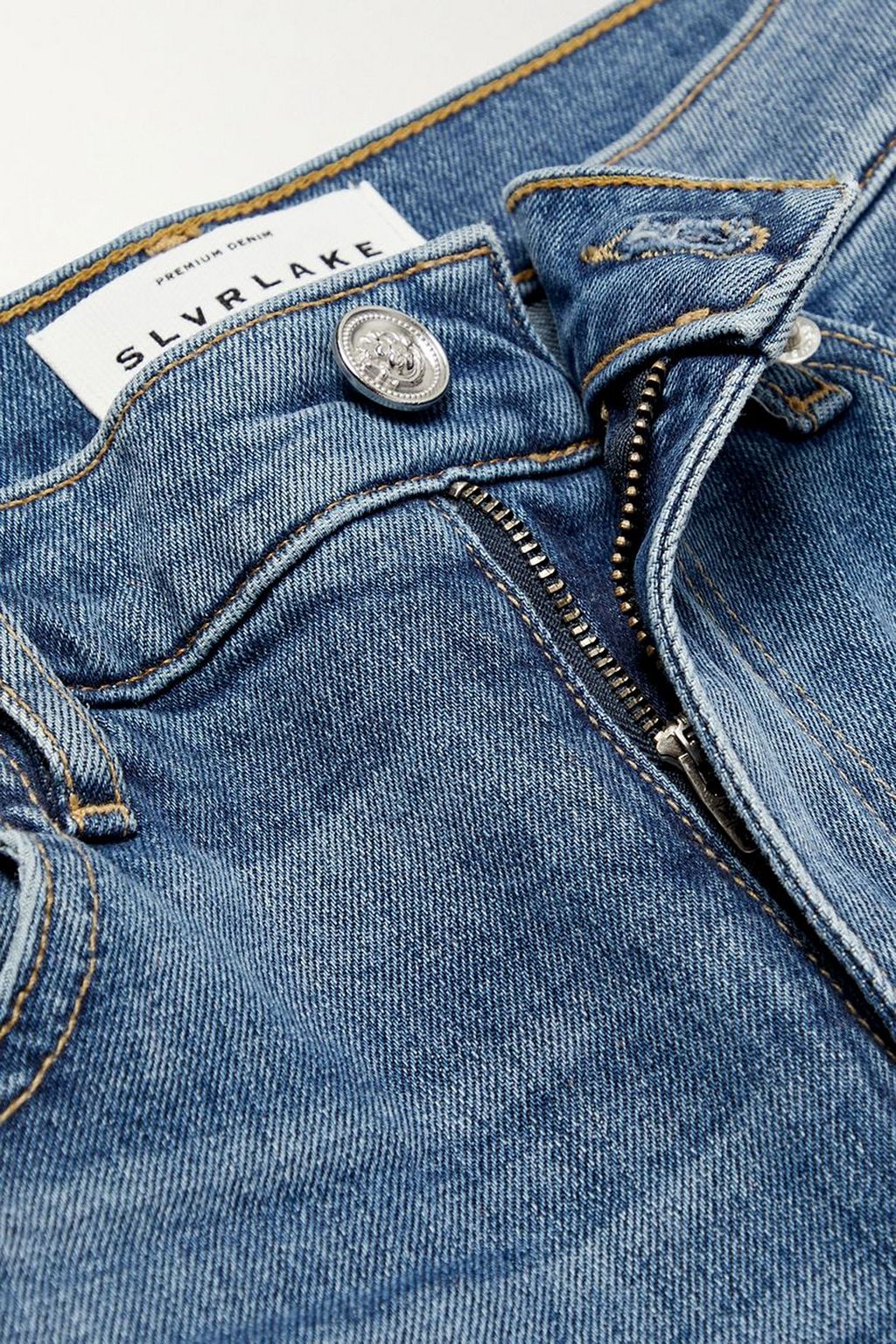 SLVRLAKE جينز Reese بحواف واسعة وخصر عالي من قماش عضوي بتأثير معتّق