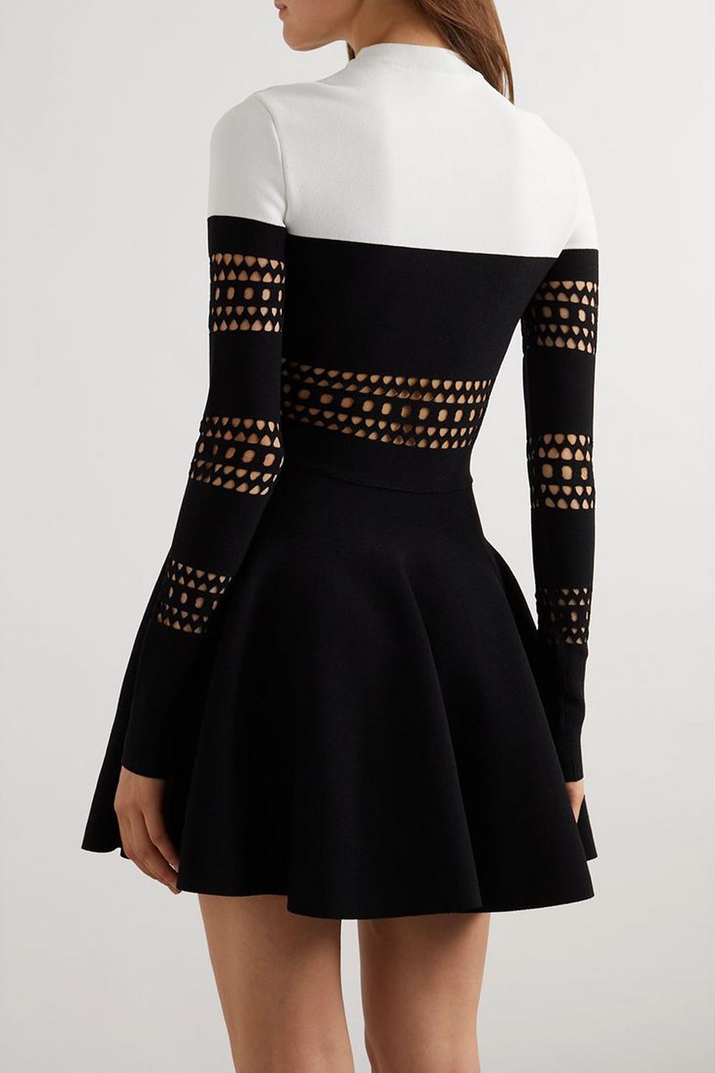 ALAÏA Two-tone laser-cut stretch-knit mini dress