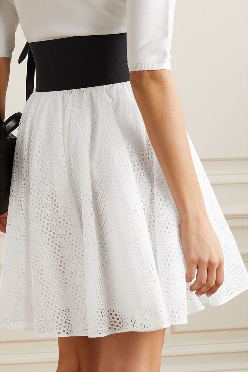 ALAÏA Laser-cut leather-trimmed broderie anglaise cotton mini skirt