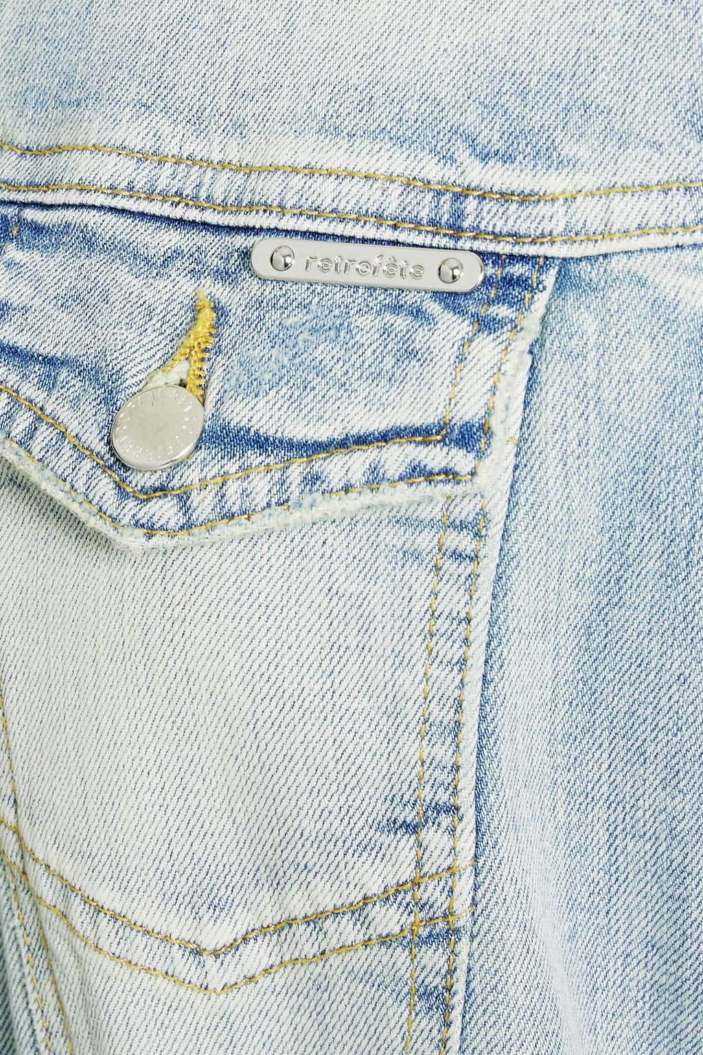 RETROFÊTE Lacey distressed faded denim jumpsuit