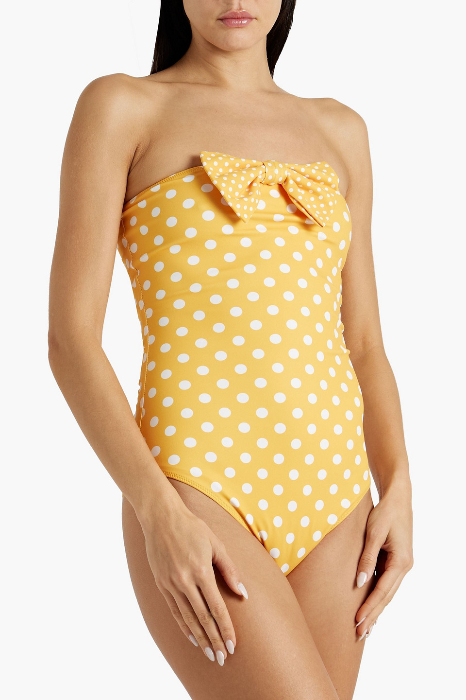 Shop Caroline Constas Evanna Bow-embellished Polka-dot Bandeau Swimsuit In Saffron