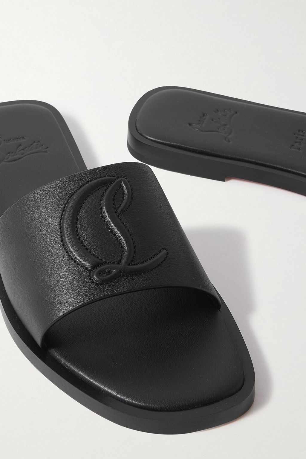 CHRISTIAN LOUBOUTIN CL logo-embossed leather slides