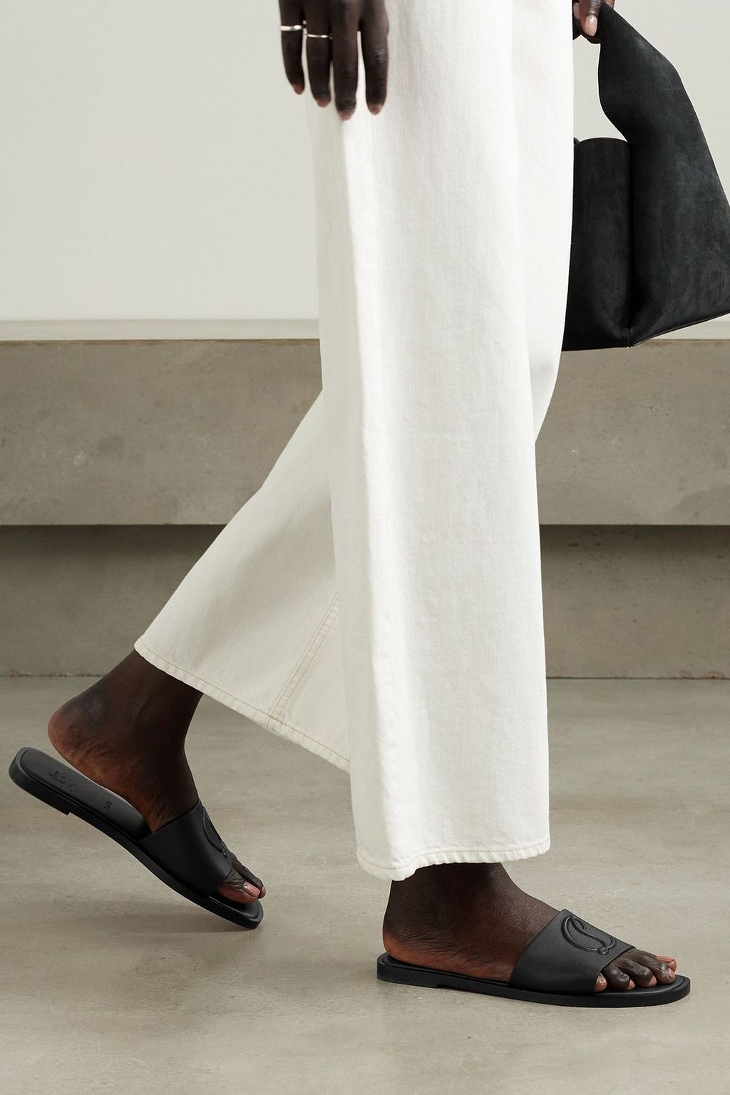 CHRISTIAN LOUBOUTIN CL logo-embossed leather slides