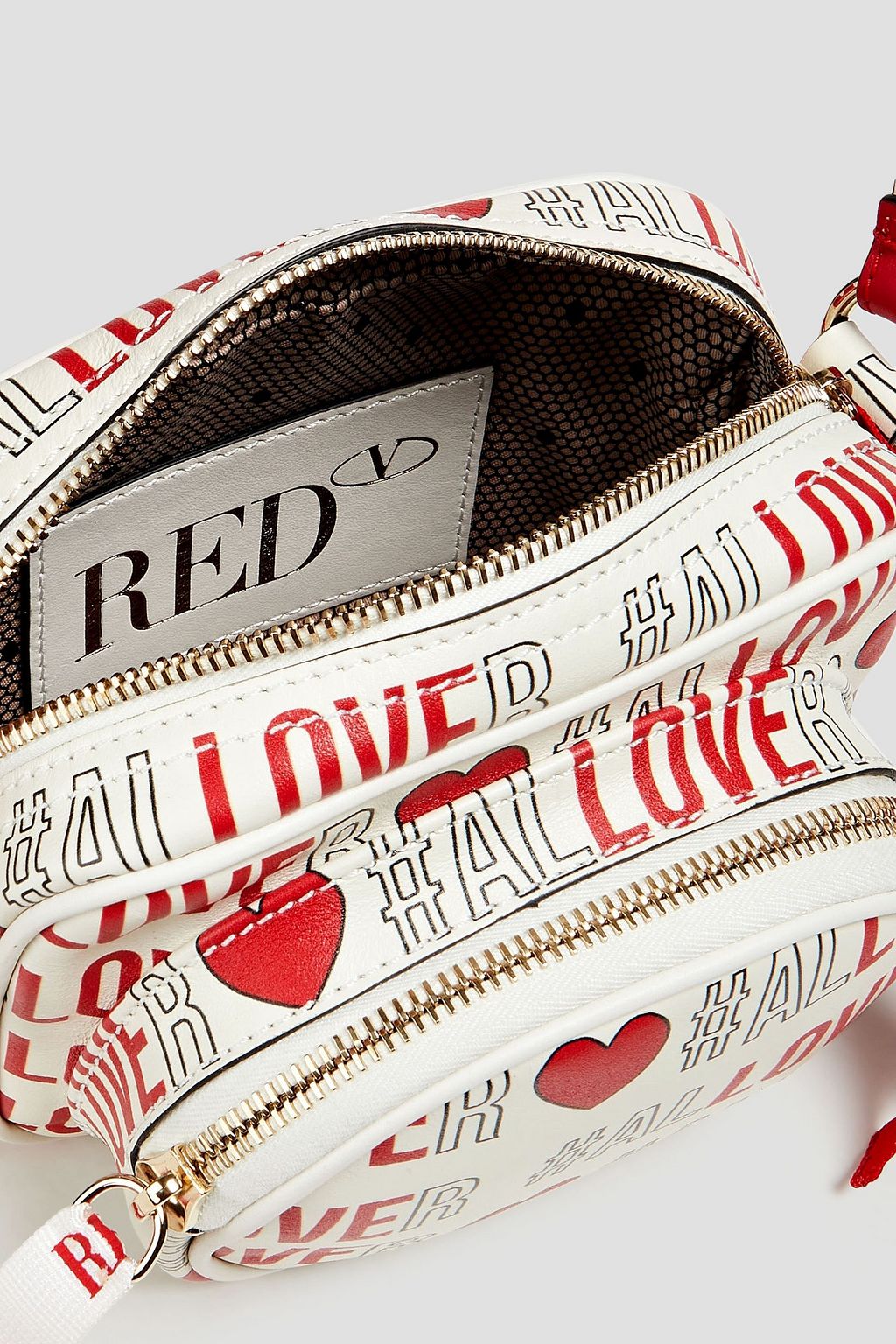 RED(V) حقيبة كتف مصنوعة من الجلد ومزينة بطبعات