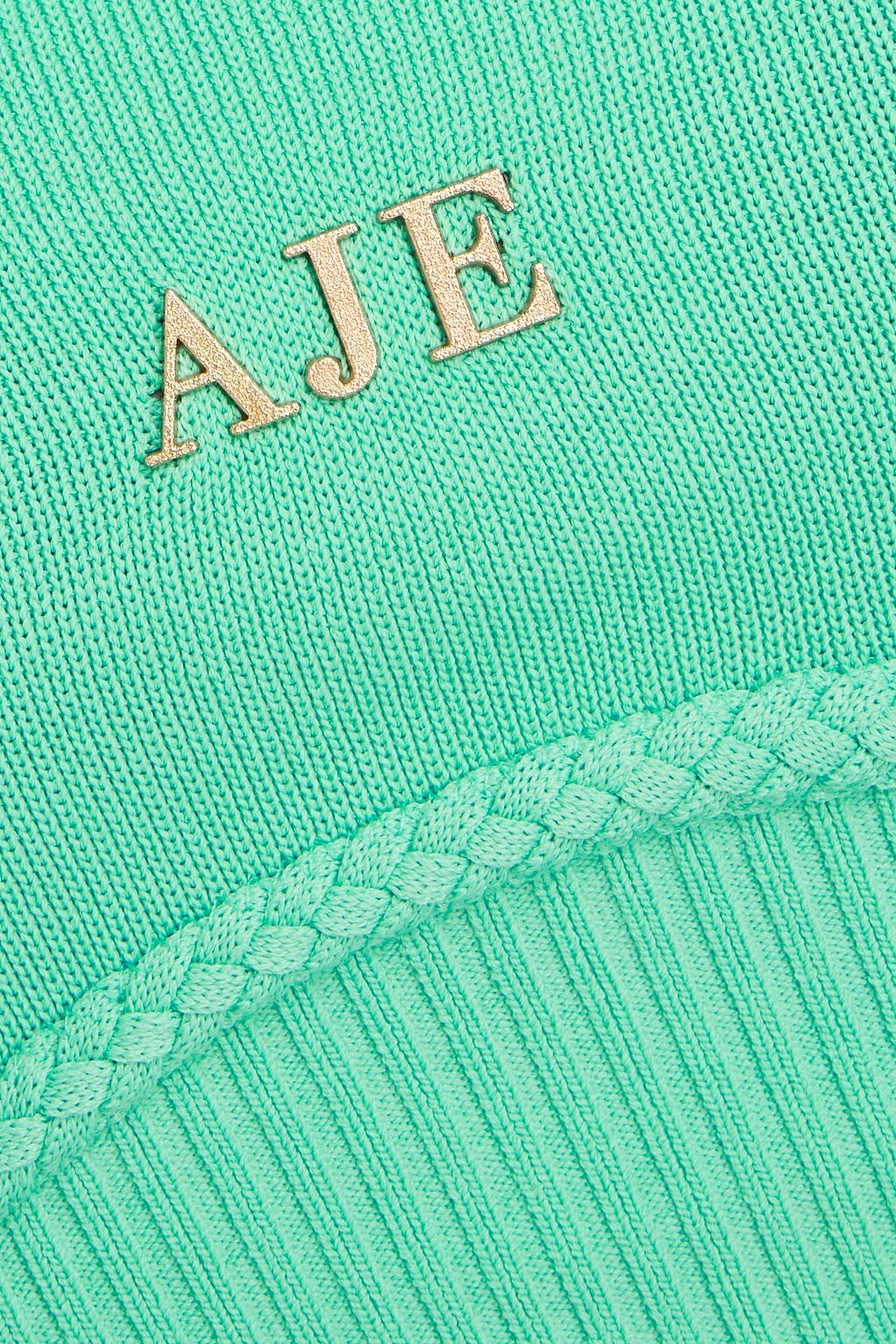 AJE. بلوزة “ريم” مصنوعة من نسيج محبوك بتصميم مزركش
