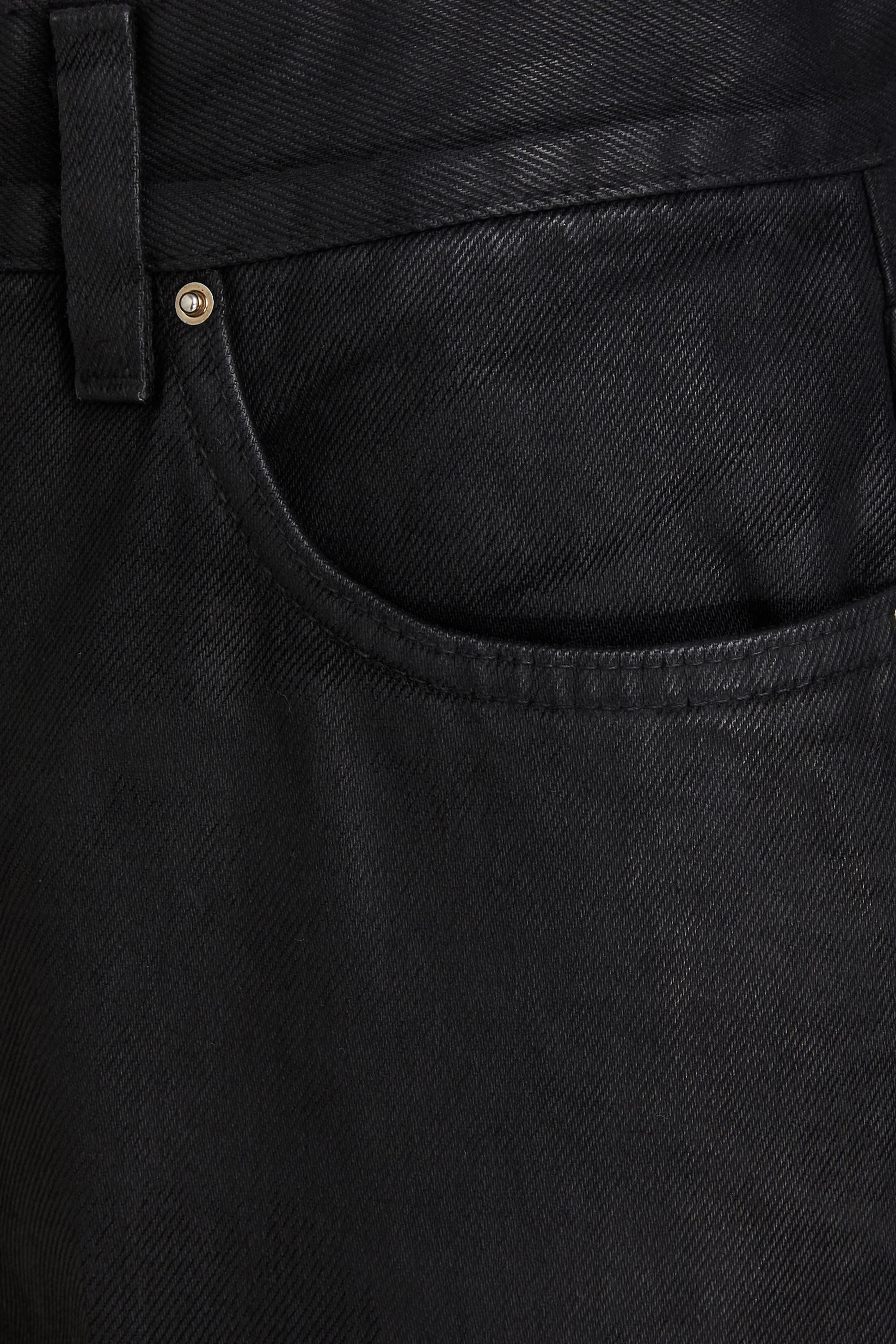 TOTEME Coated high-rise tapered jeans