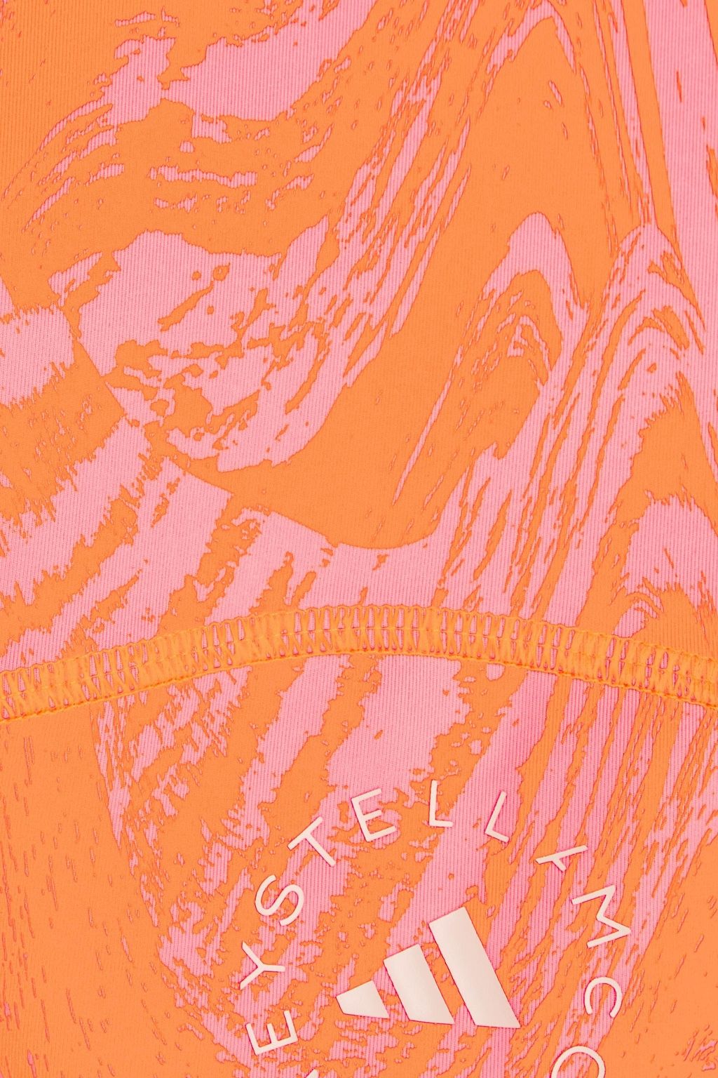 ADIDAS BY STELLA MCCARTNEY بلوزة قصيرة من نسيج مطاطي مزينة بطبعات وأجزاء مقصوصة