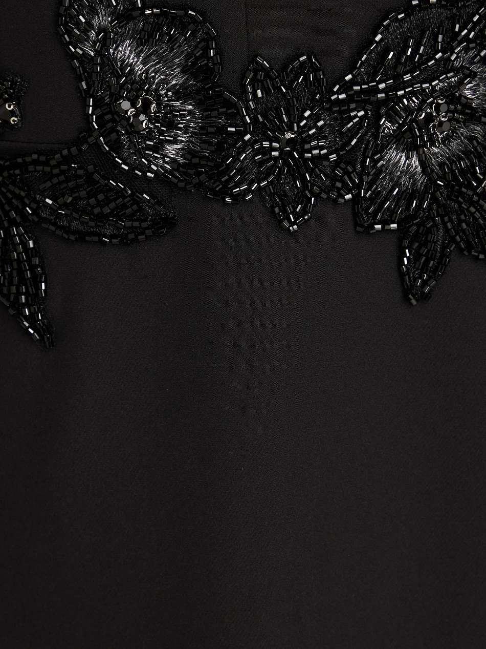 cape-effect embellished crepe gown