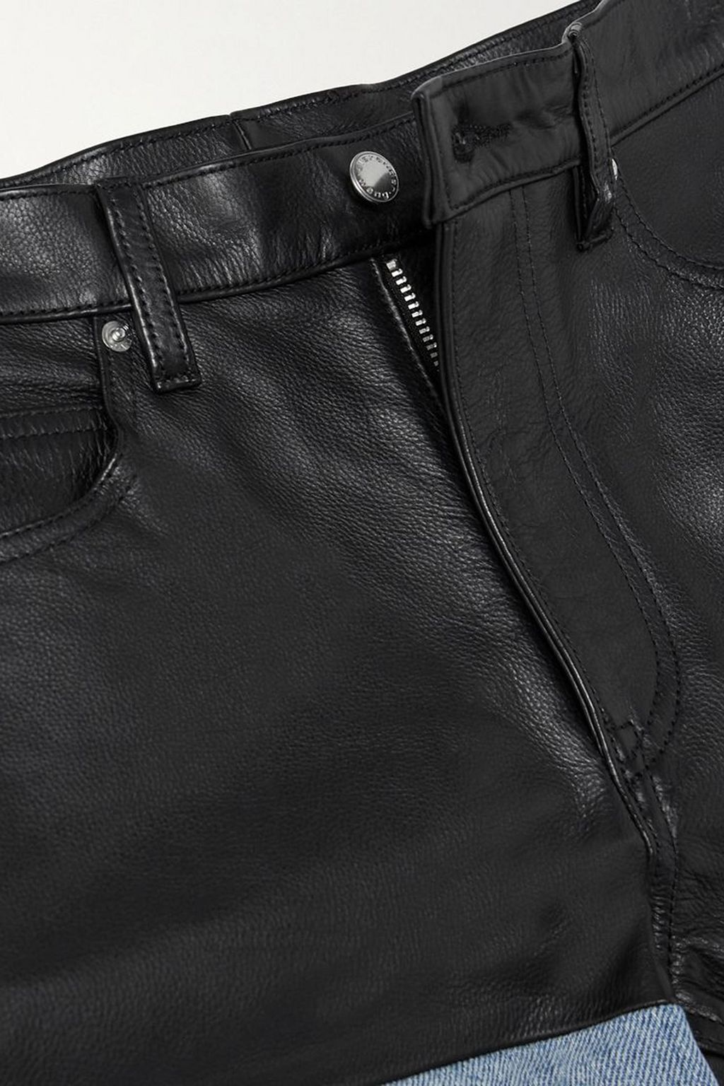 ALEXANDER WANG بنطال جينز منخفض الخصر بقطع محاكة بجانب بعضها البعض