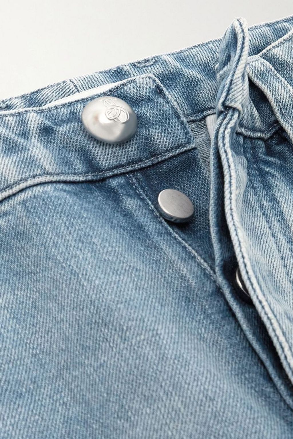 JIL SANDER Cropped bleached paneled high-rise tapered jeans