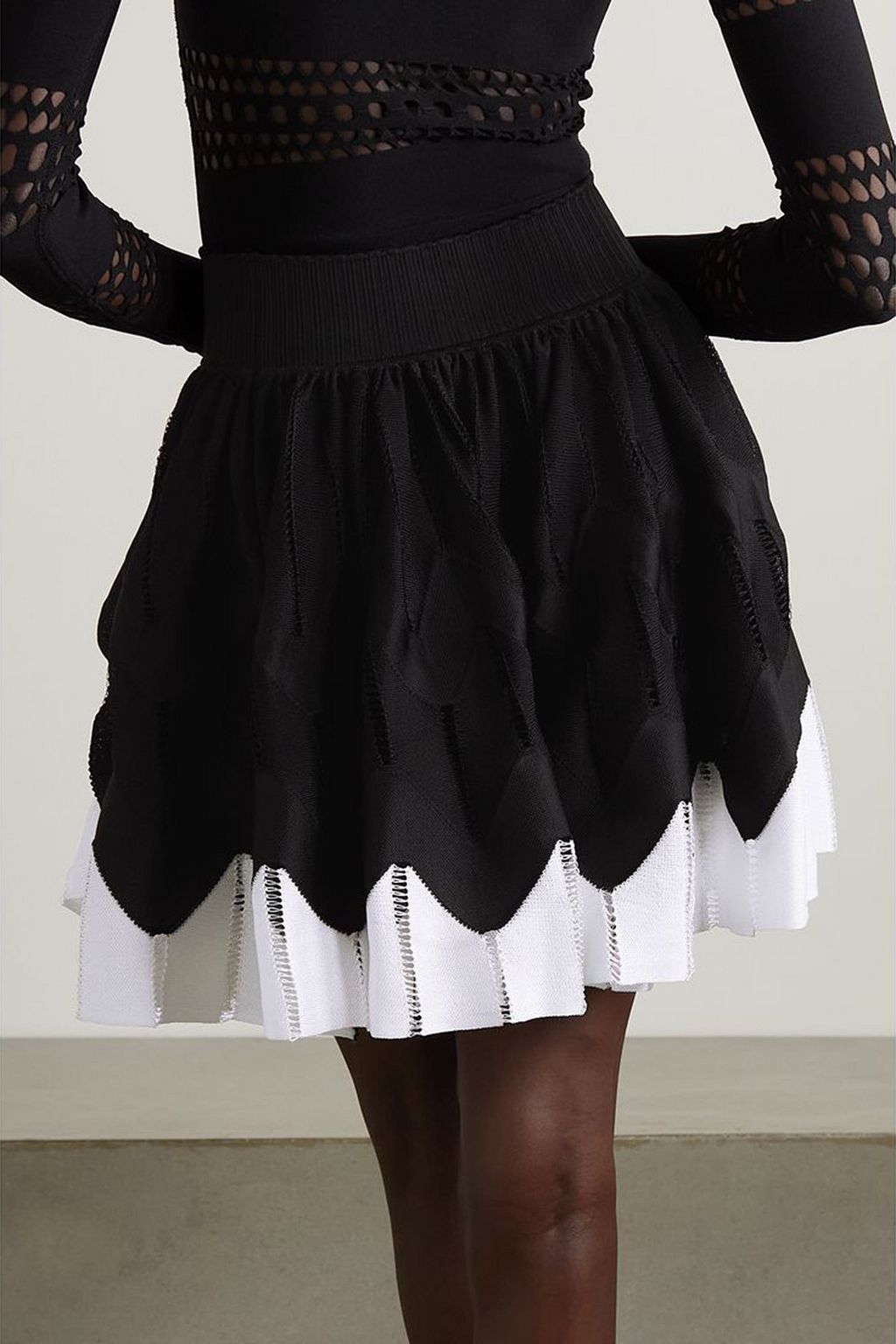 ALAÏA Two-tone pleated stretch-knit mini skirt