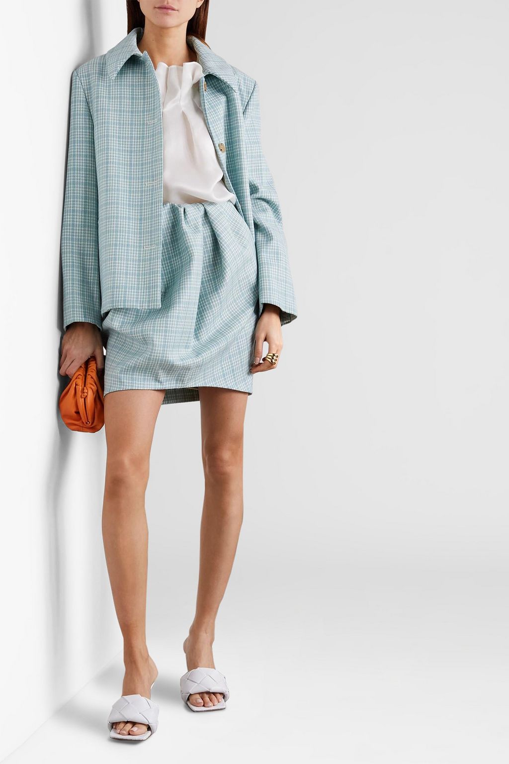 NINA RICCI تنورة قصيرة من التويد الصوفي بنقشة مربّعات بتصميم ملموم