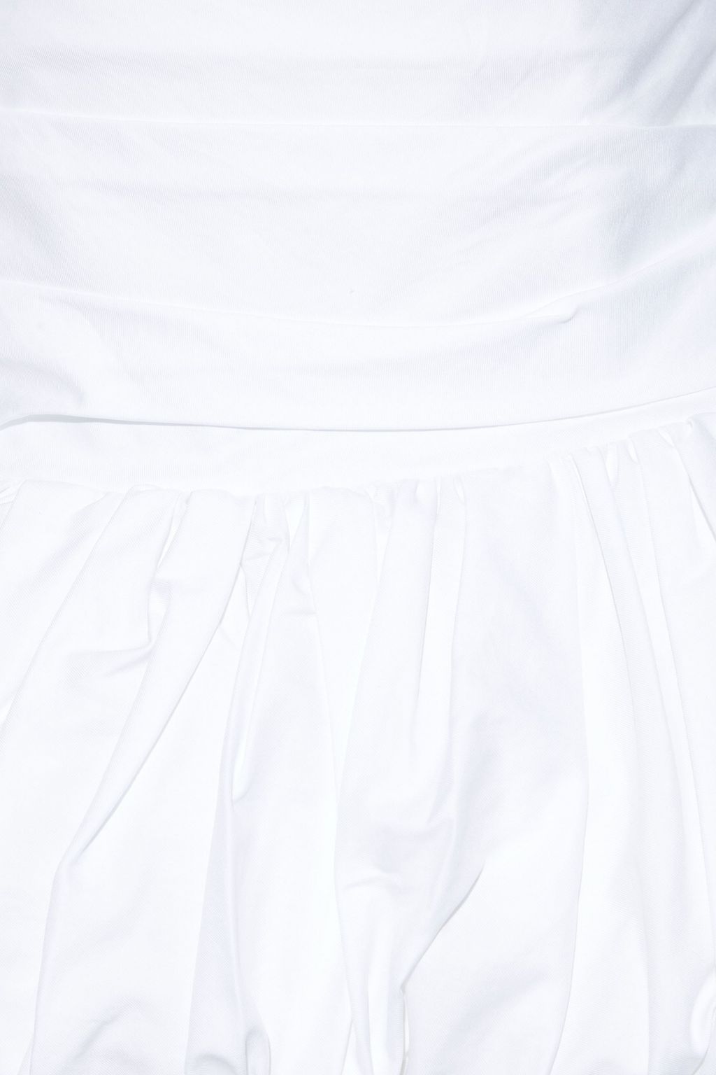 KHAITE Kimmy strapless pleated cotton-poplin peplum top