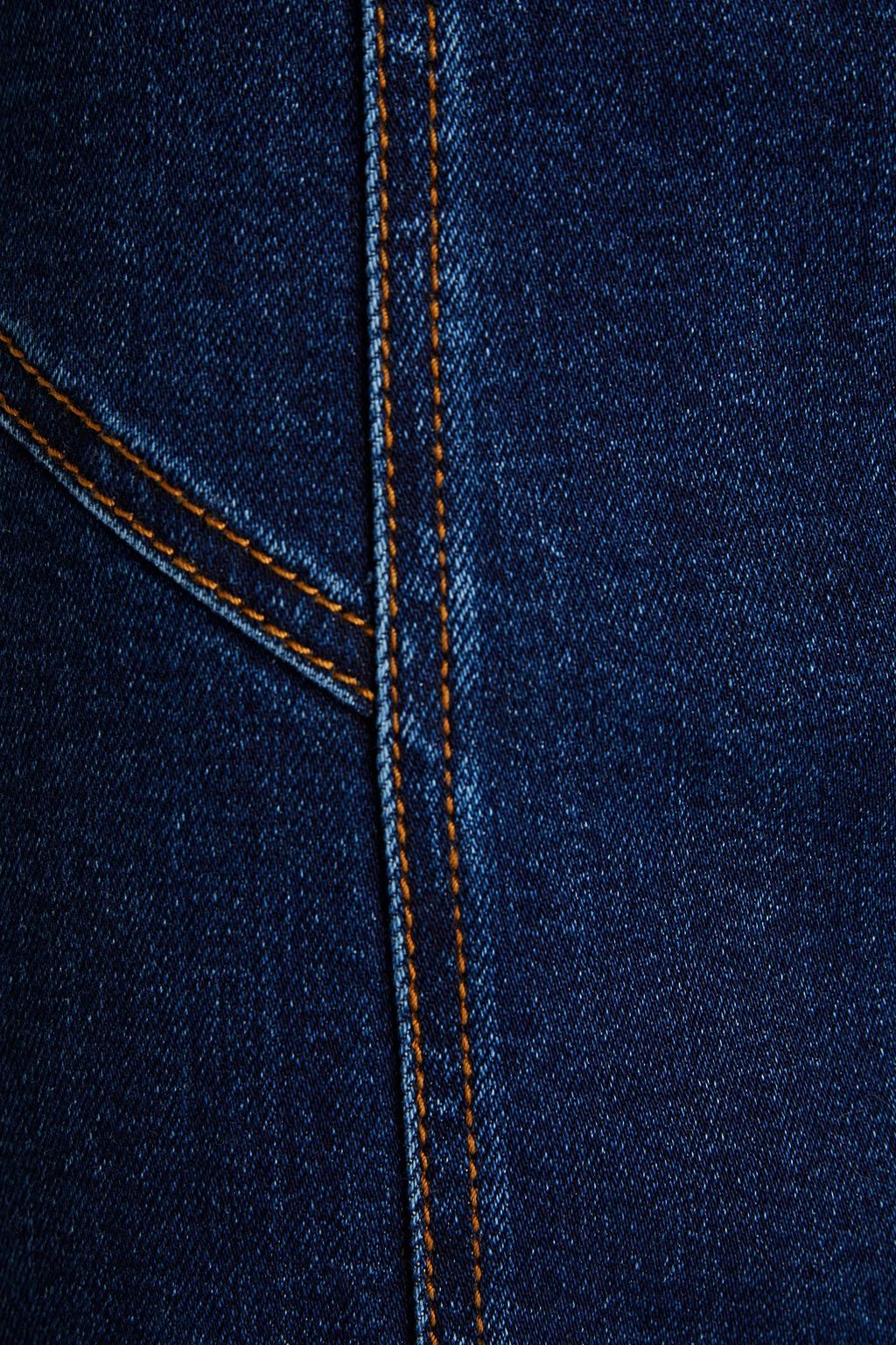 MCQUEEN Leather-trimmed frayed denim skirt