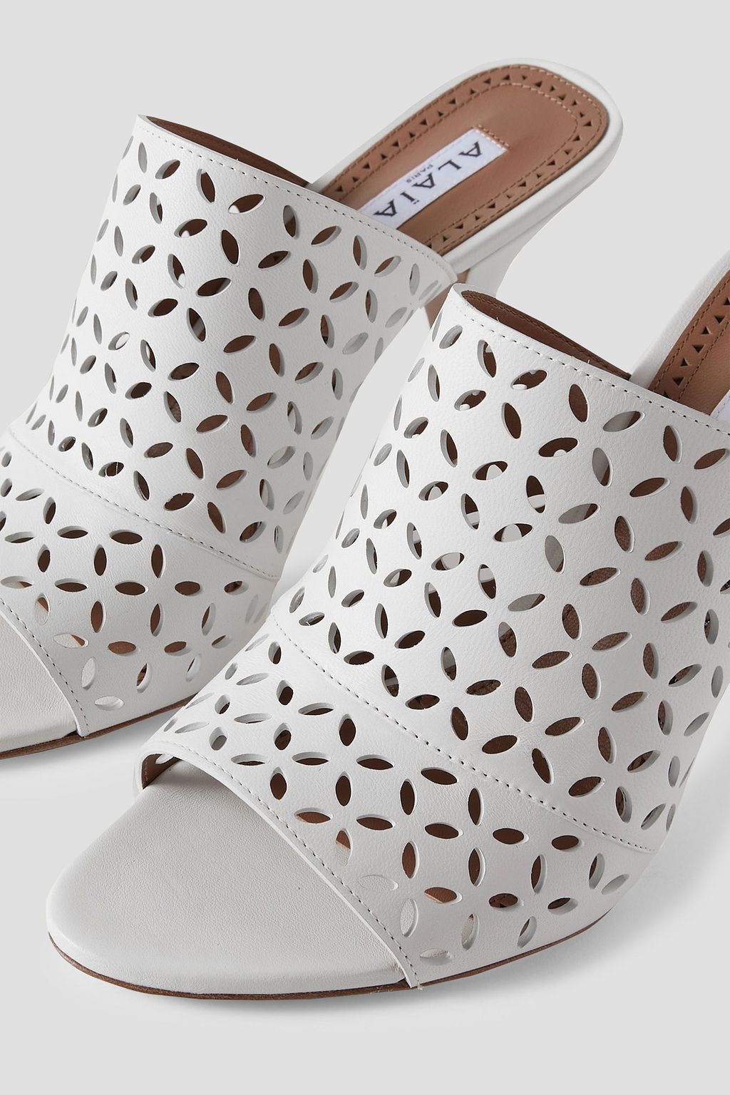 ALAÏA 90 laser-cut leather mules