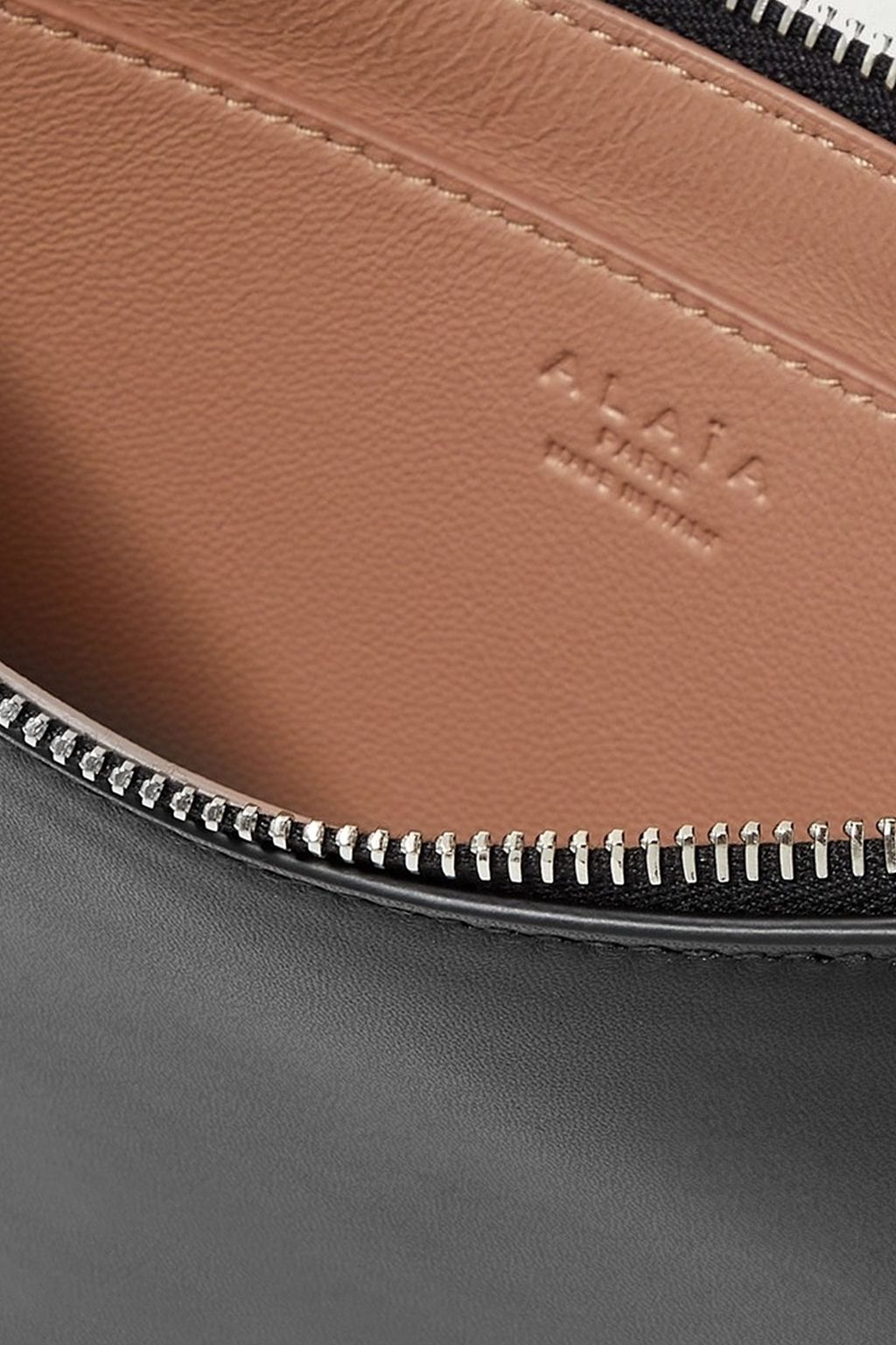 ALAÏA Demi Lune laser-cut studded leather shoulder bag