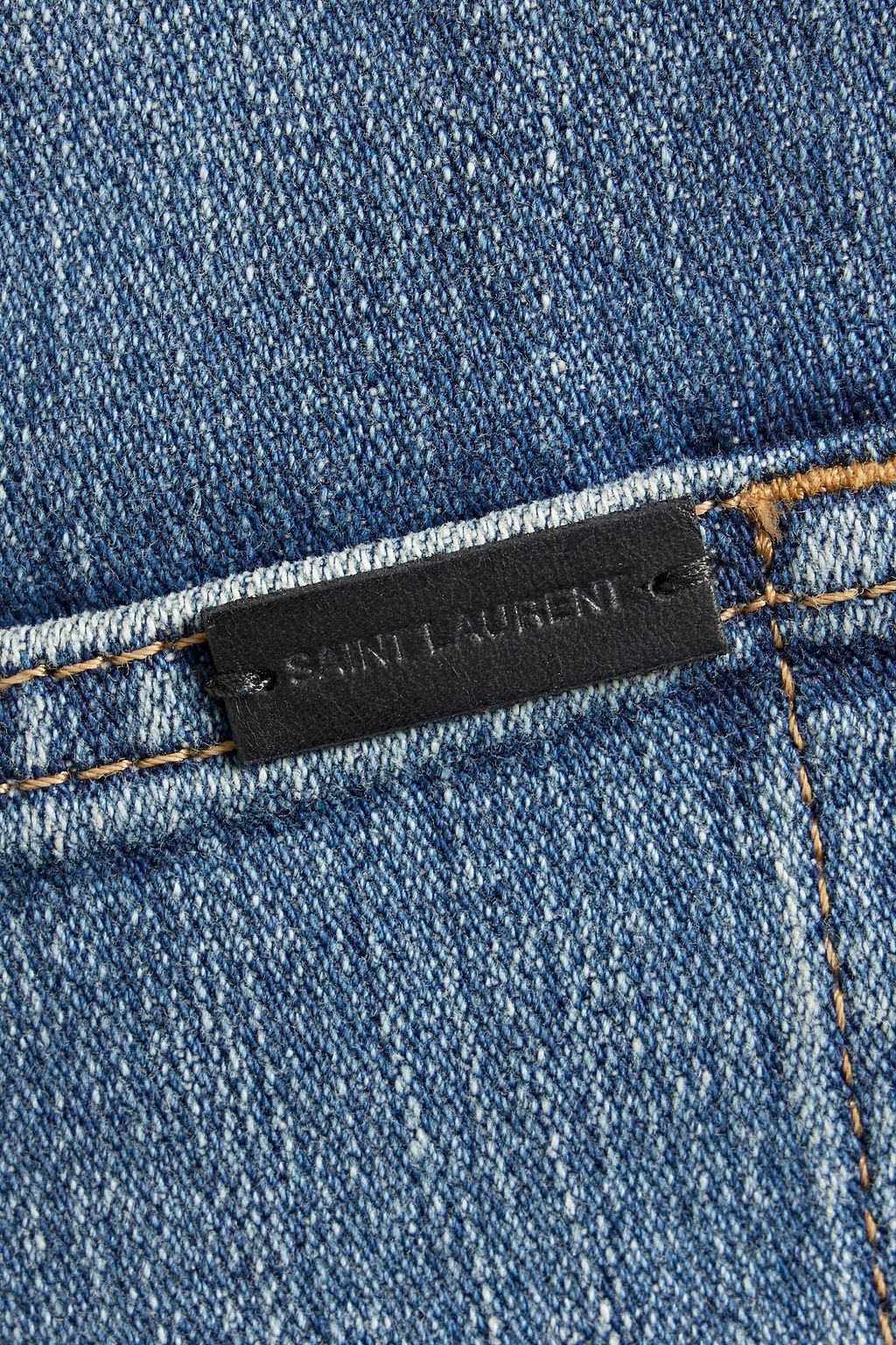 SAINT LAURENT Frayed denim shorts