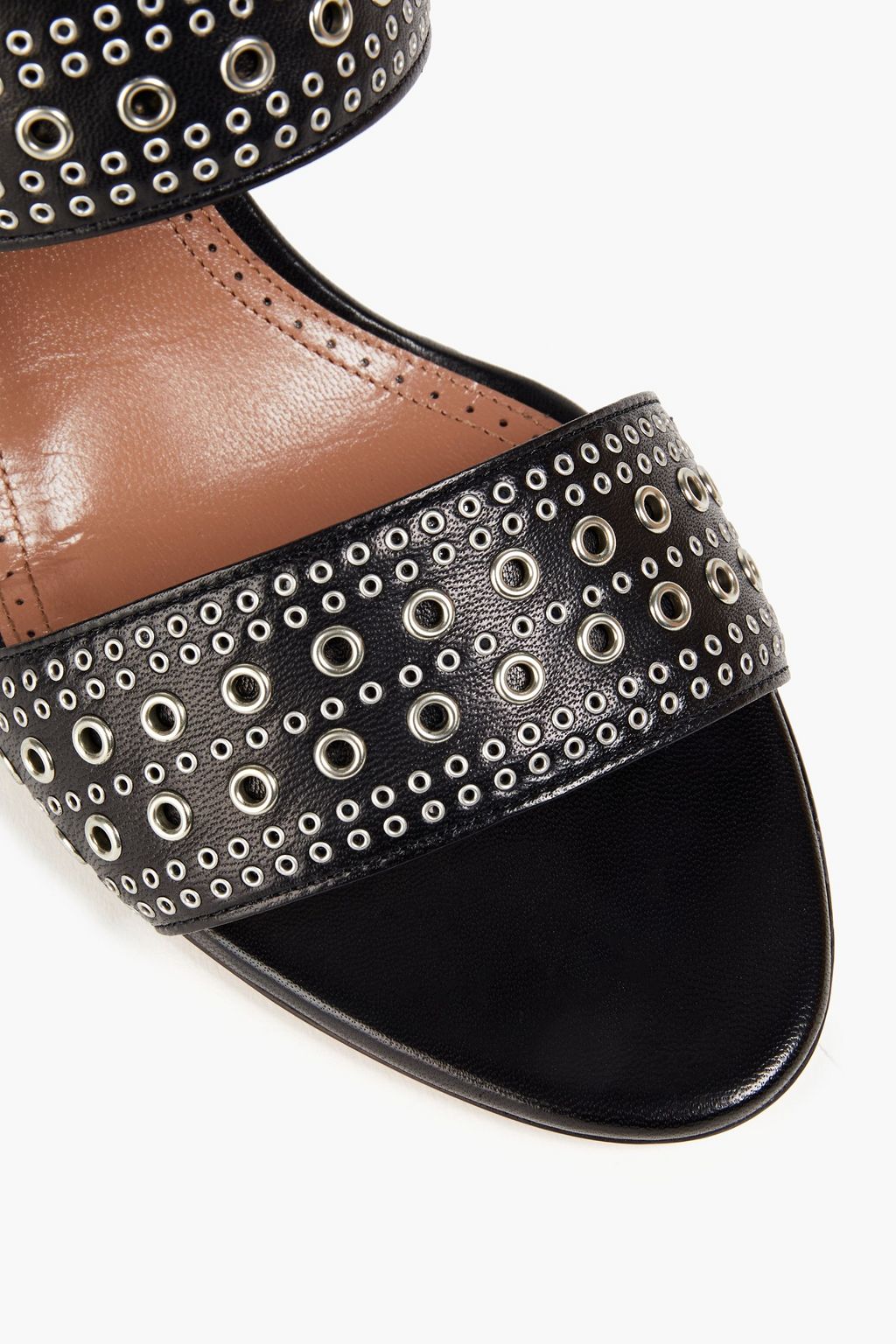 ALAÏA Mules aus Leder mit Ösenverzierung