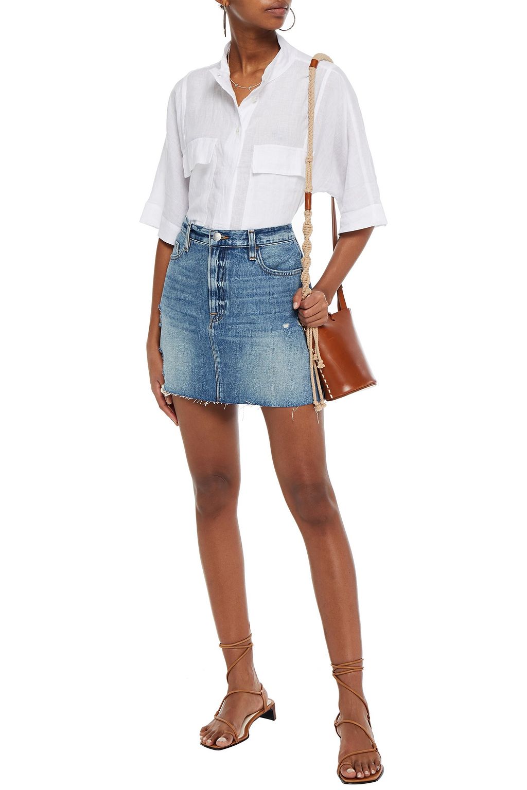 FRAME Distressed faded denim mini skirt