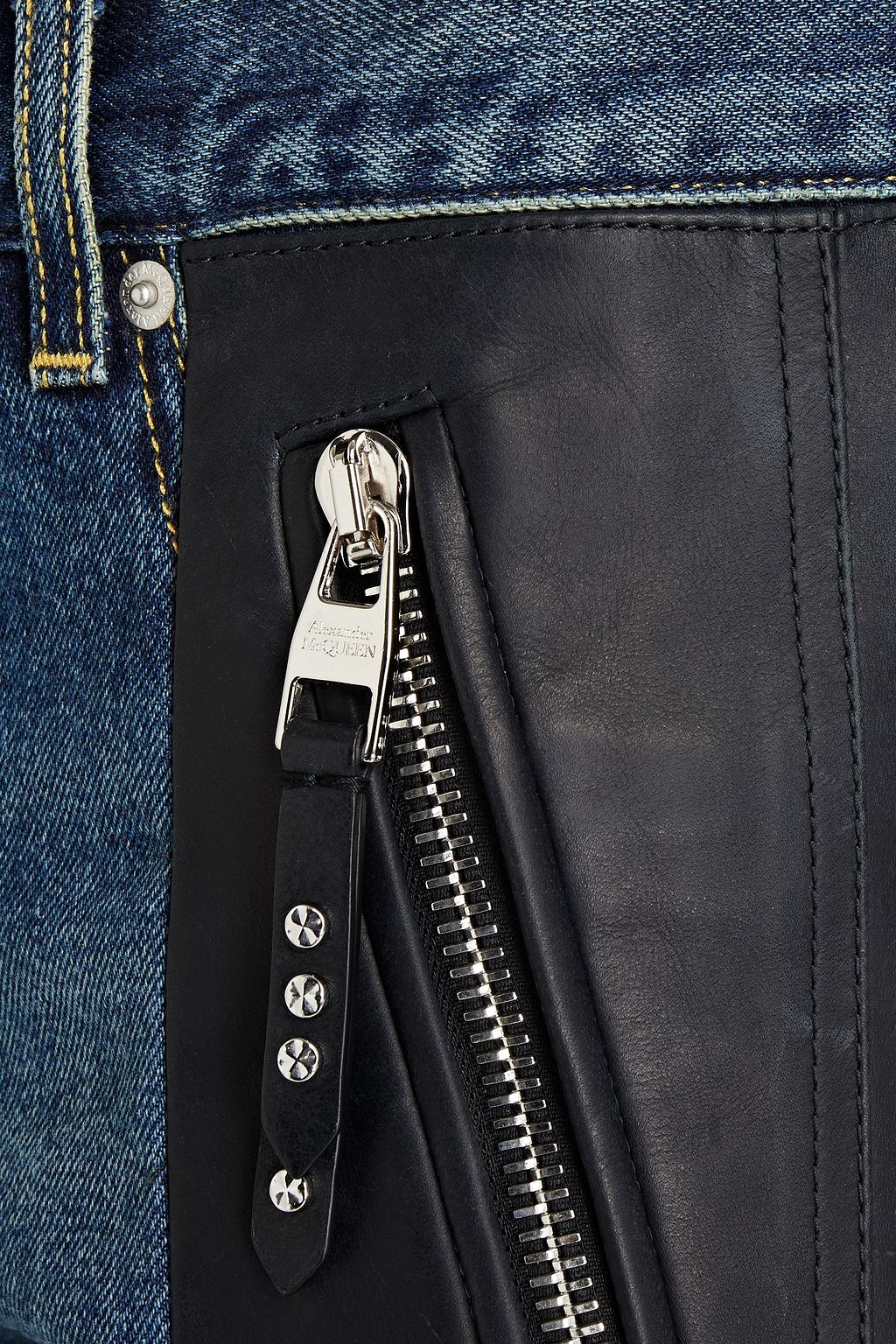 MCQUEEN Slim-fit leather-paneled faded denim jeans
