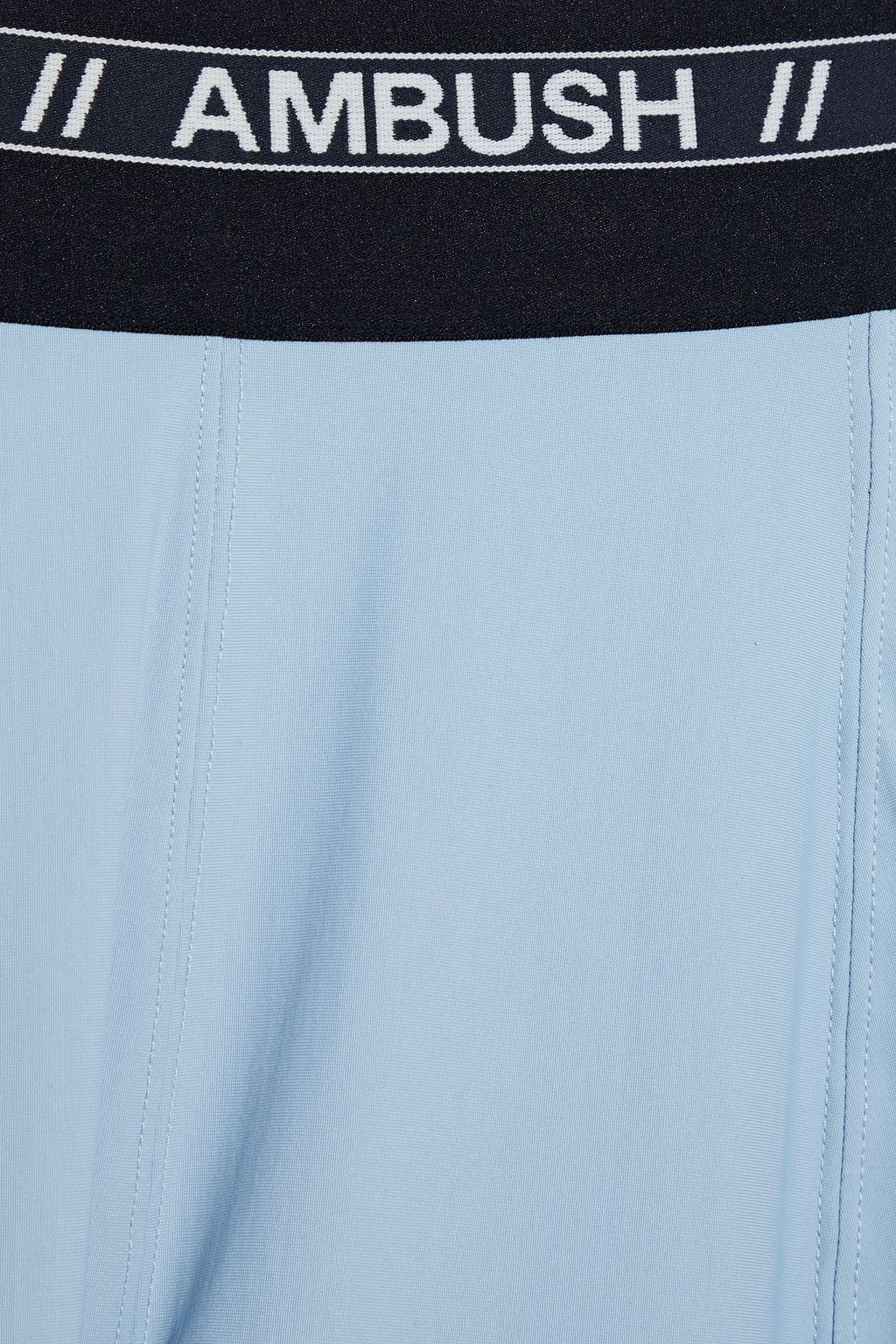 AMBUSH Printed scuba leggings THE