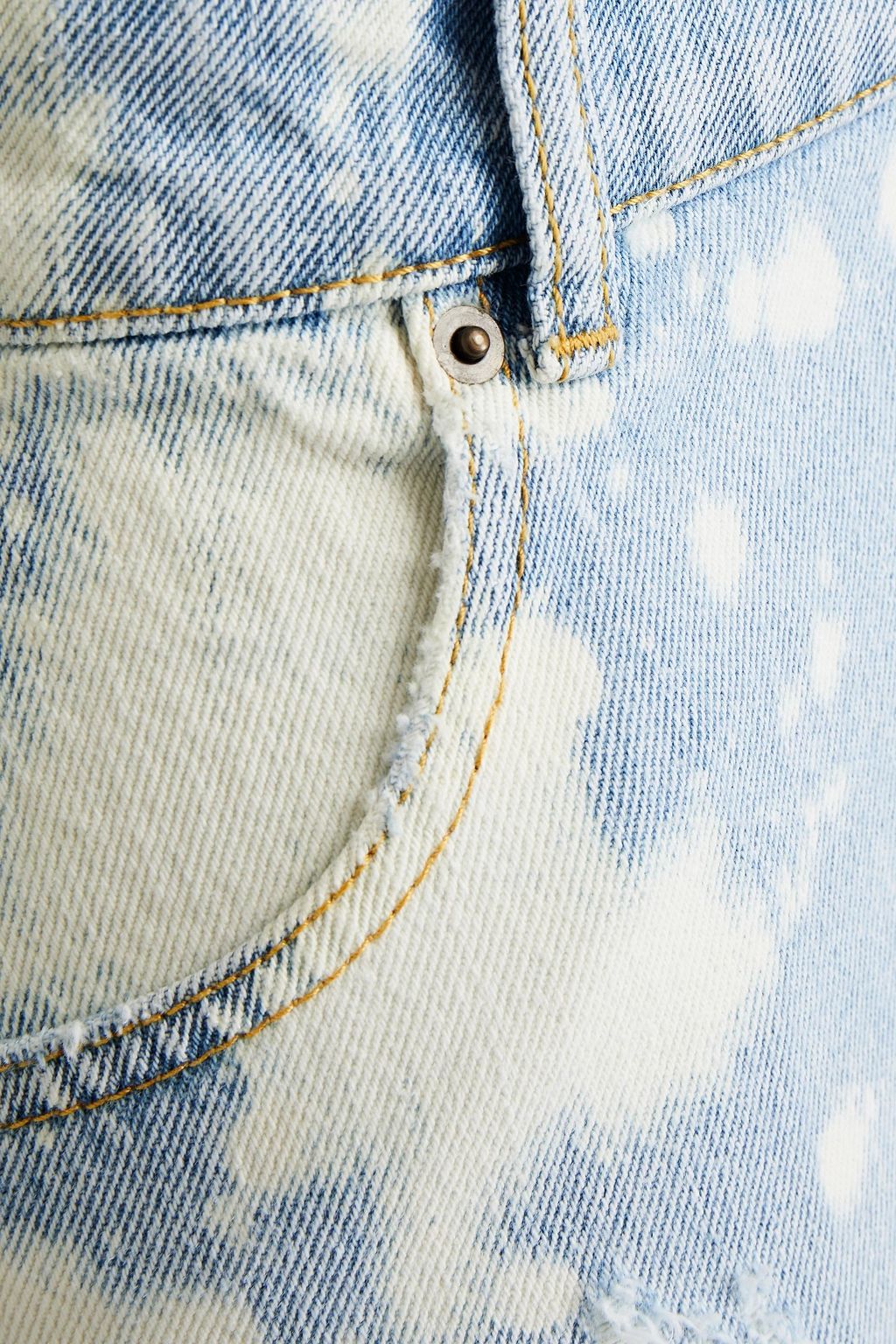 RETROFÊTE Distressed bleached denim mini skirt