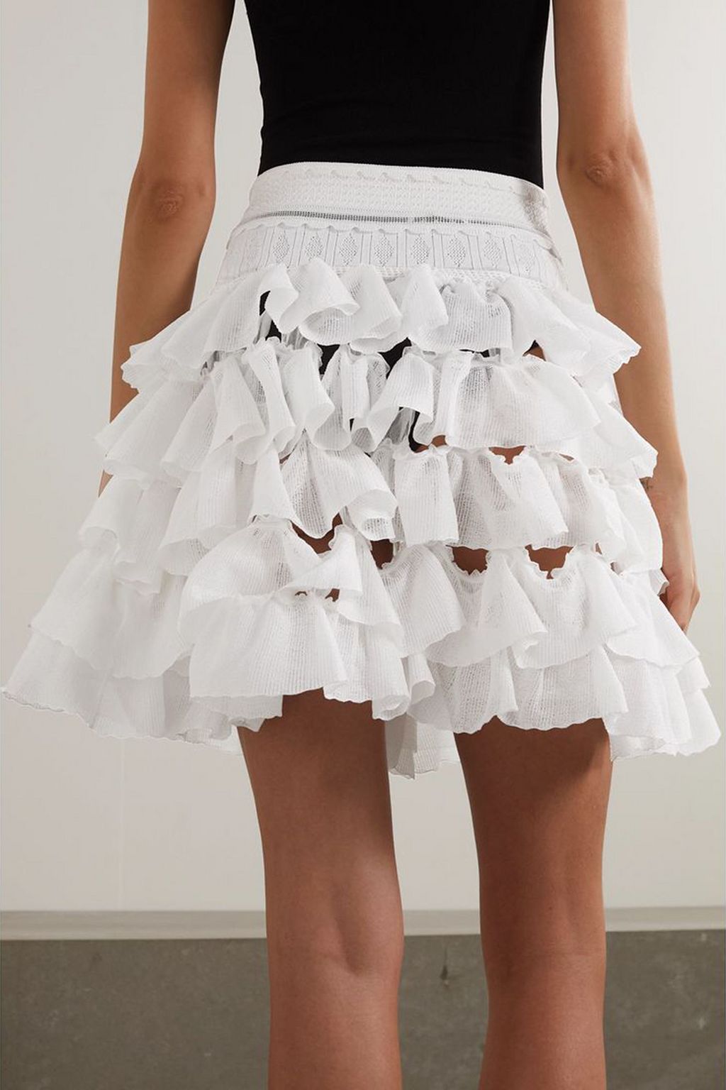 ALAÏA Ruffled tiered stretch-knit mini skirt