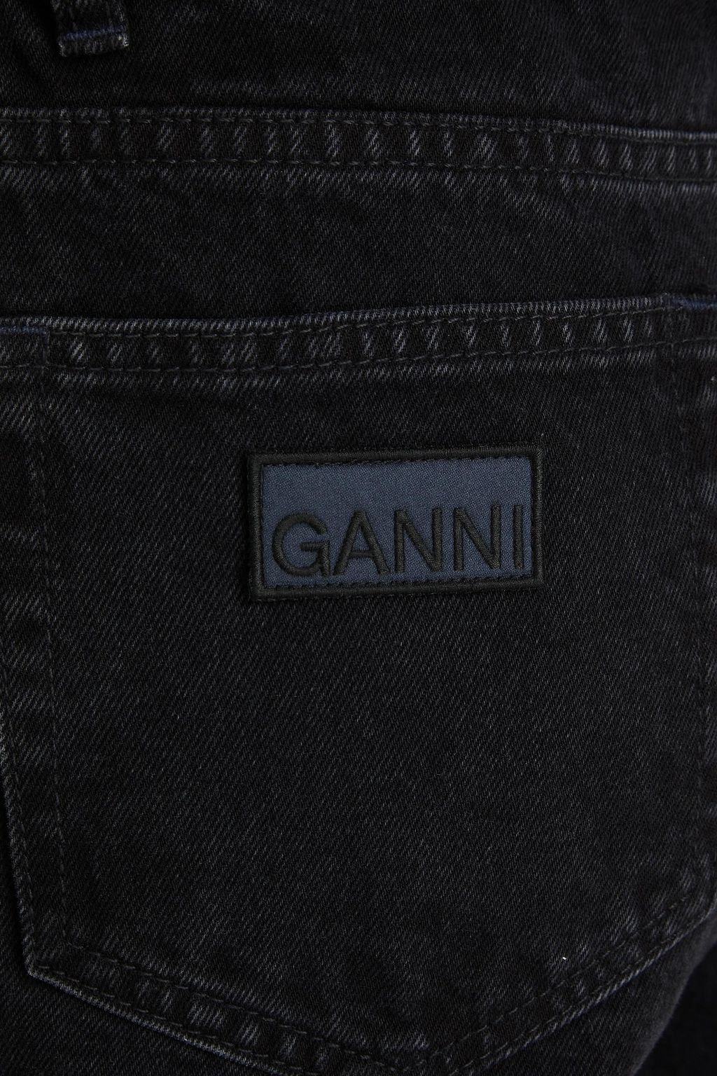 GANNI بنطال جينز بأرجل واسعة وبخصر عالٍ