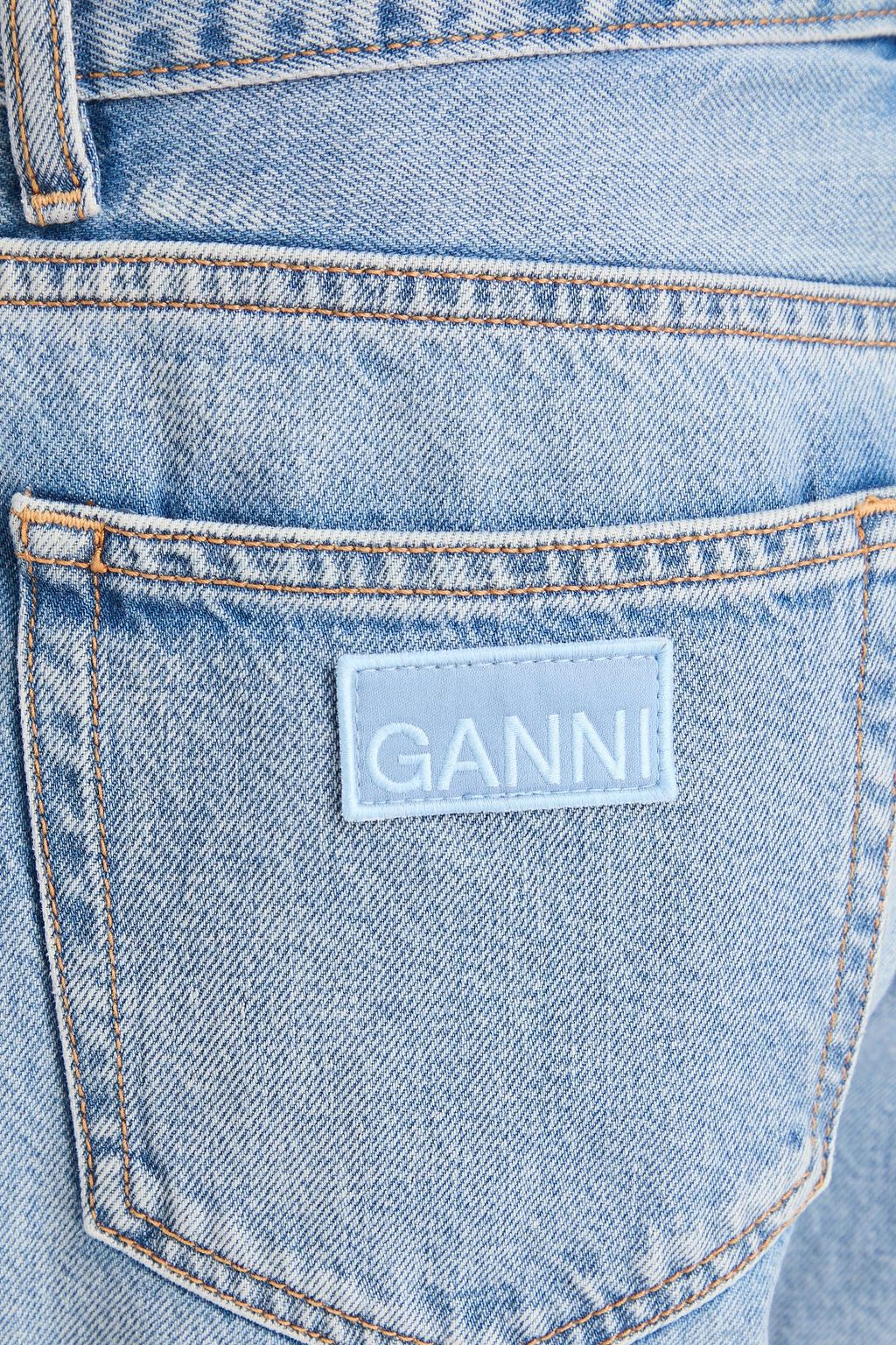 GANNI جينز بأرجل مستقيمة وبخصر مرتفع بلون باهت