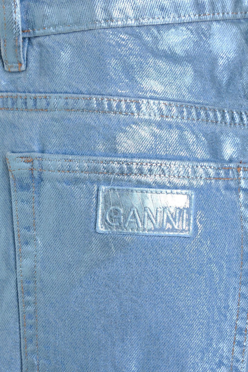 GANNI جينز بأرجل ضيّقة وبخصر مرتفع الخصر ومطلي بلون معدني