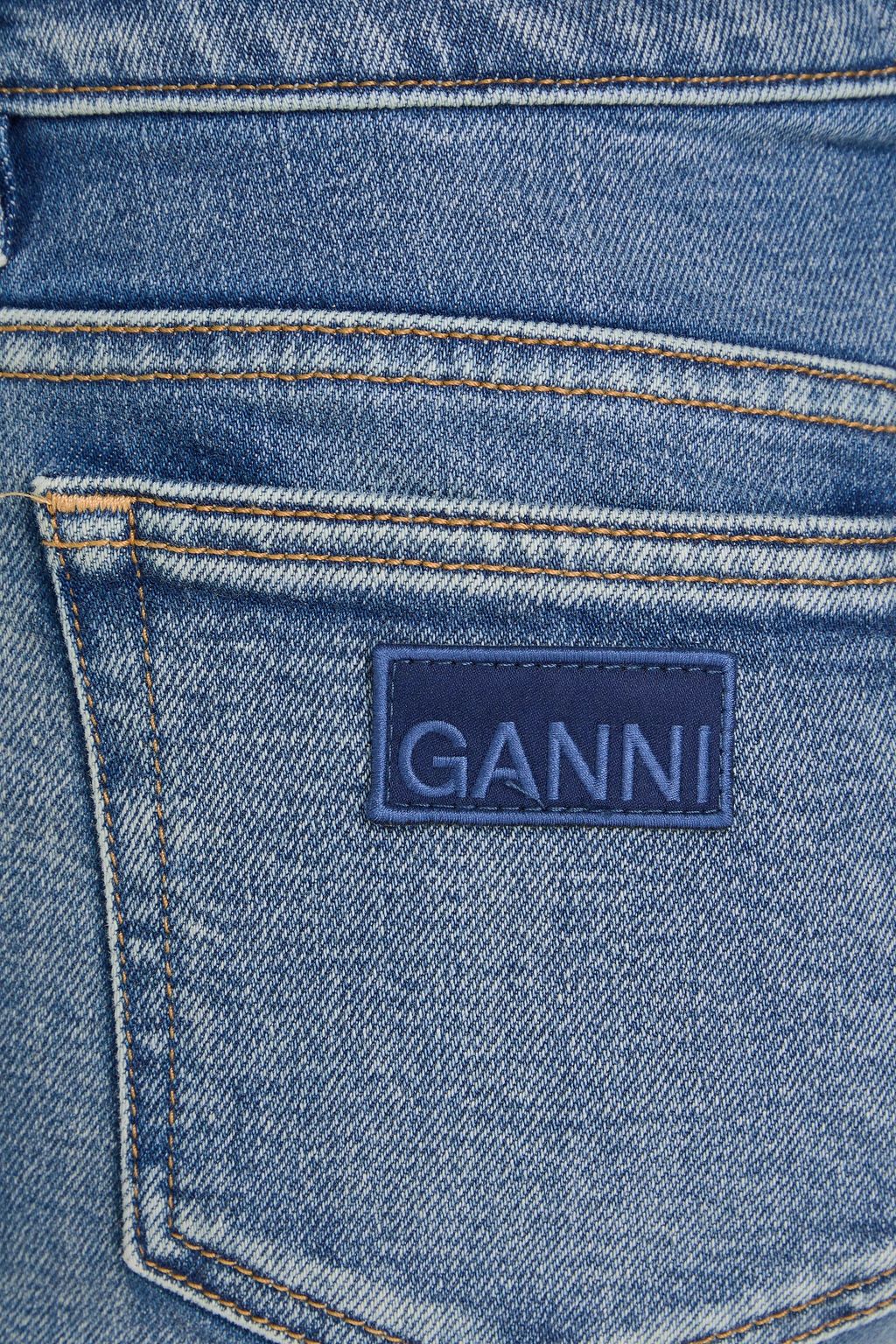 GANNI جينز بأرجل مستقيمة وبخصر عالٍ