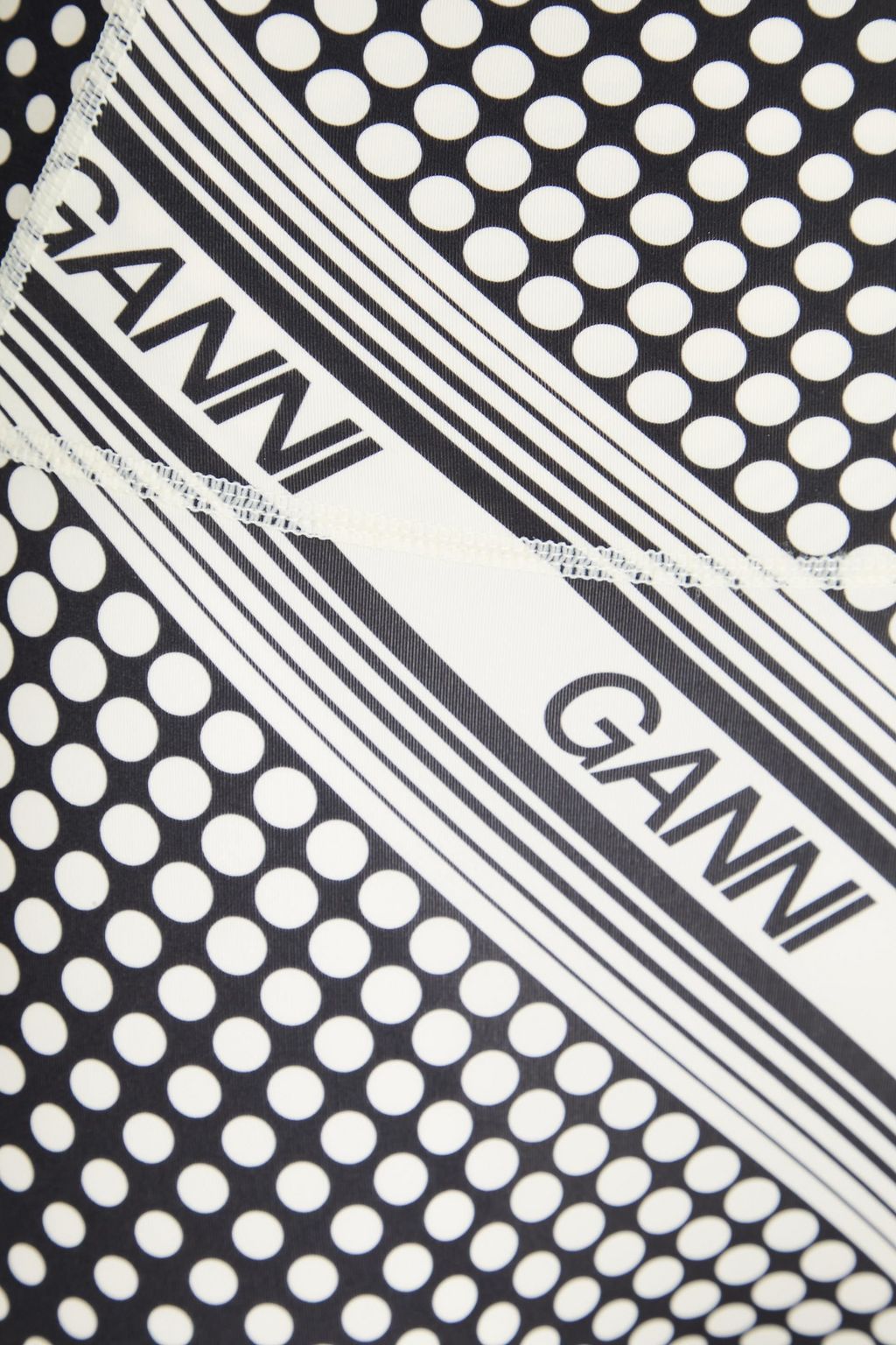 GANNI بنطلون ضيق من الجيرسي الرياضي مزين بطبعات