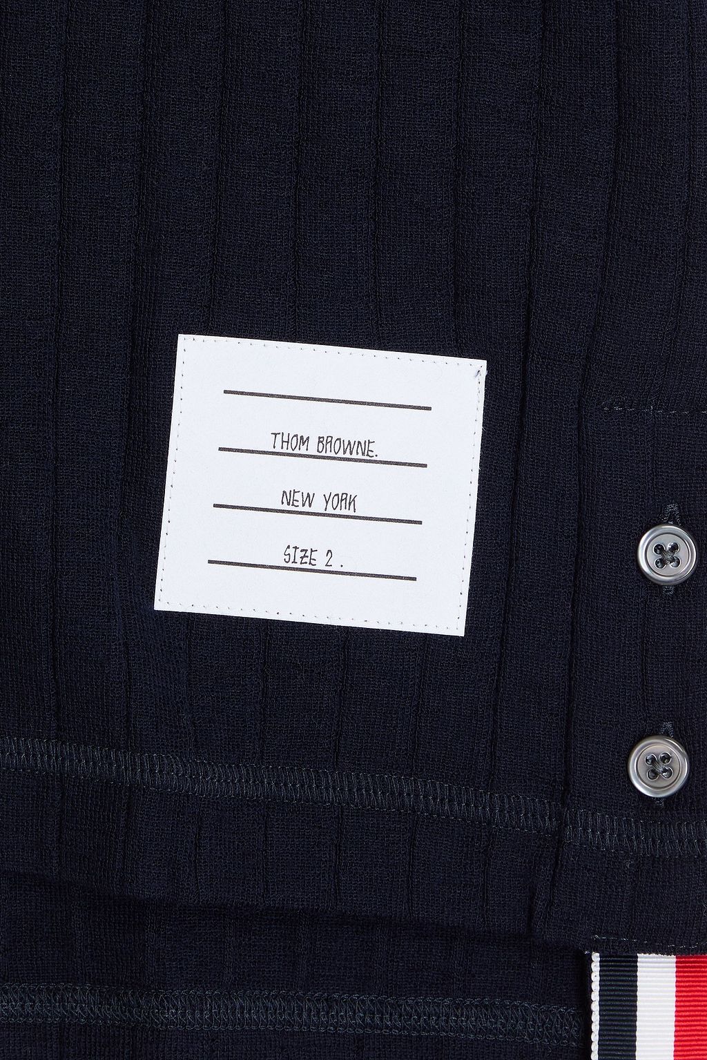 THOM BROWNE قميص بولو من الصوف المضلّع