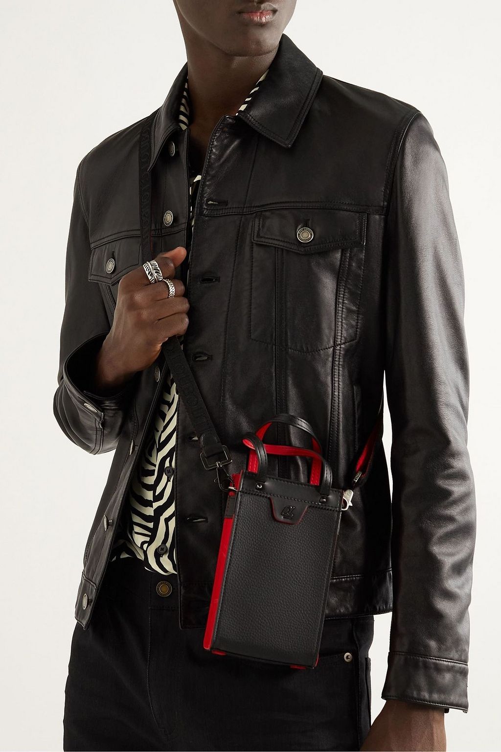 CHRISTIAN LOUBOUTIN Ruistote leather and rubbed-trimmed messenger bag