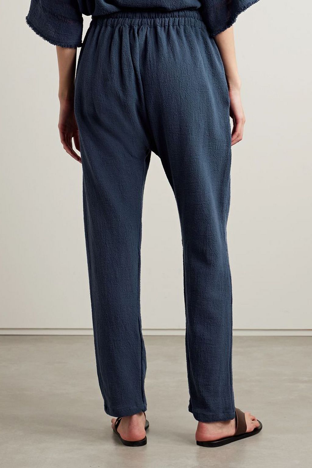CARAVANA Wakun leather-trimmed distressed cotton-gauze track pants